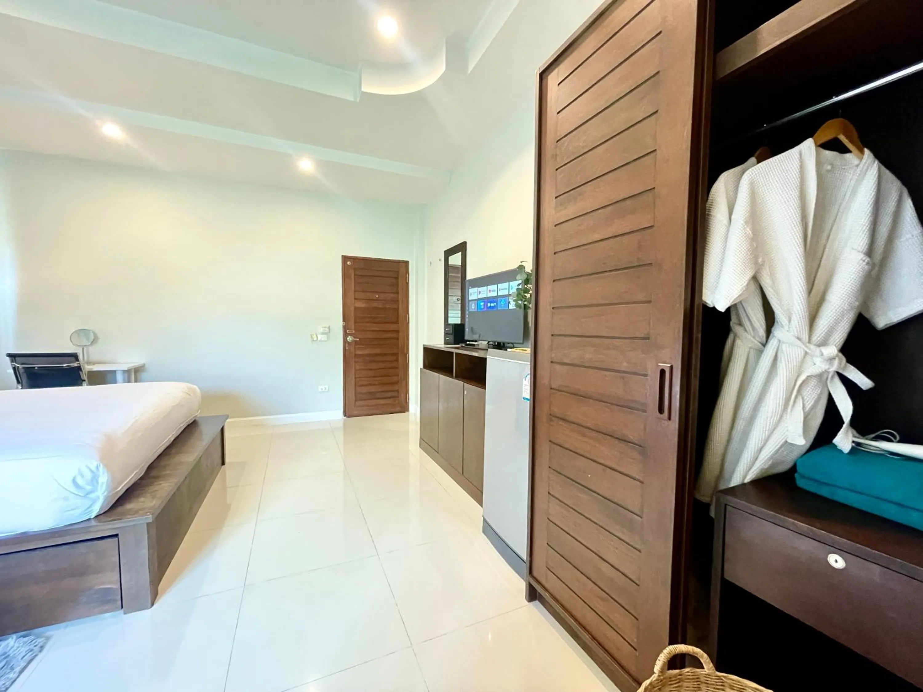 Bed in The Langstan Suites