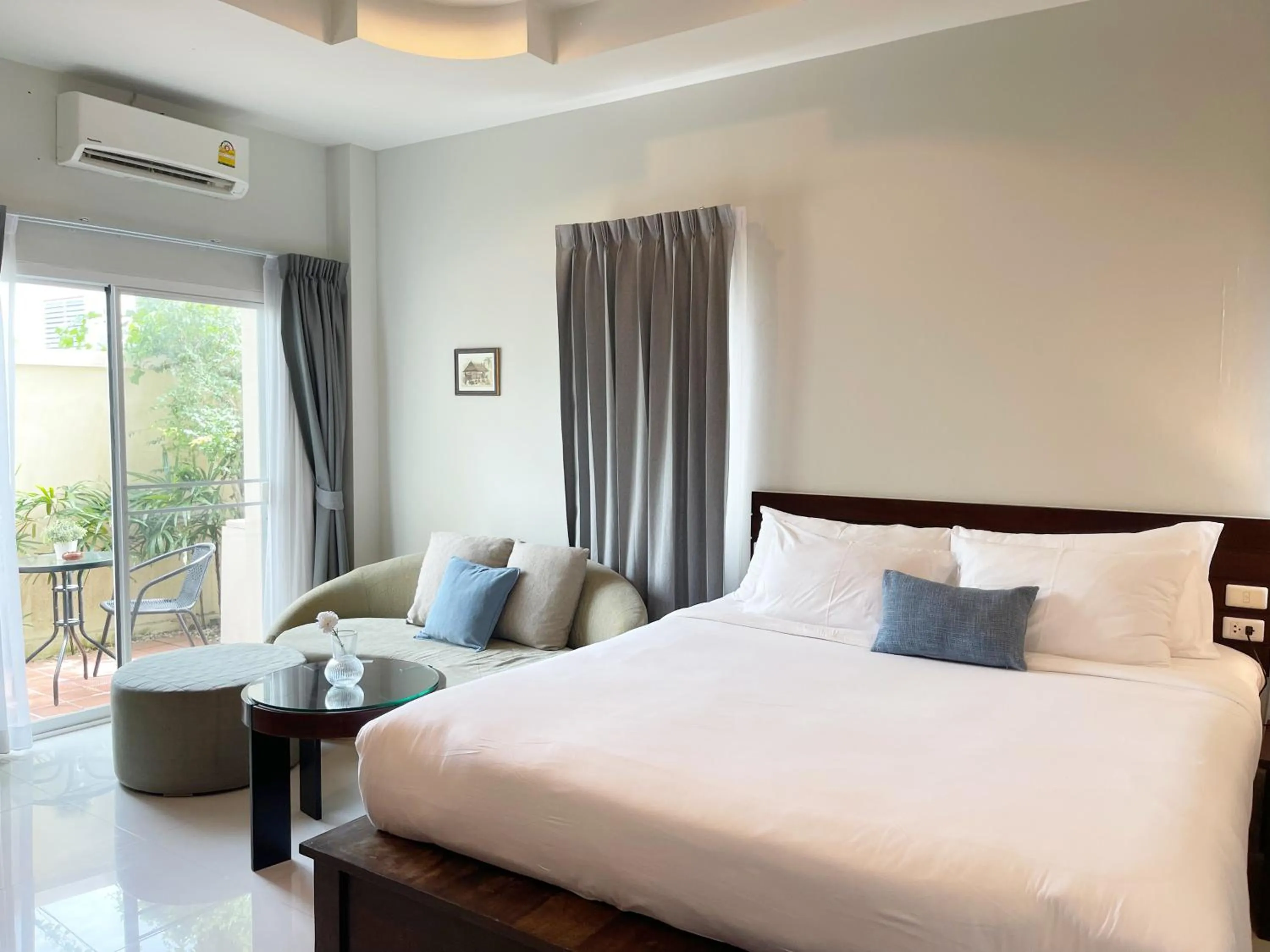 Bed in The Langstan Suites