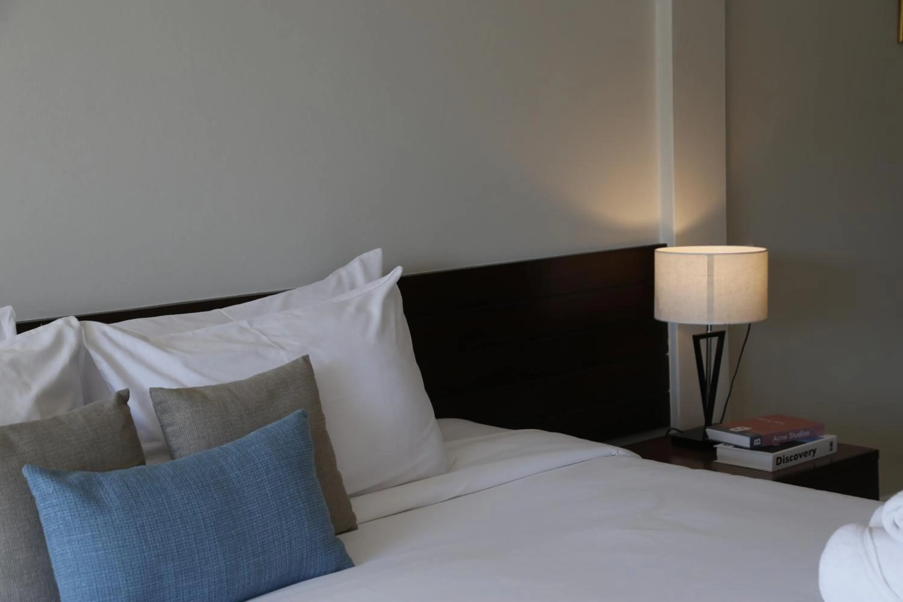 Bed in The Langstan Suites