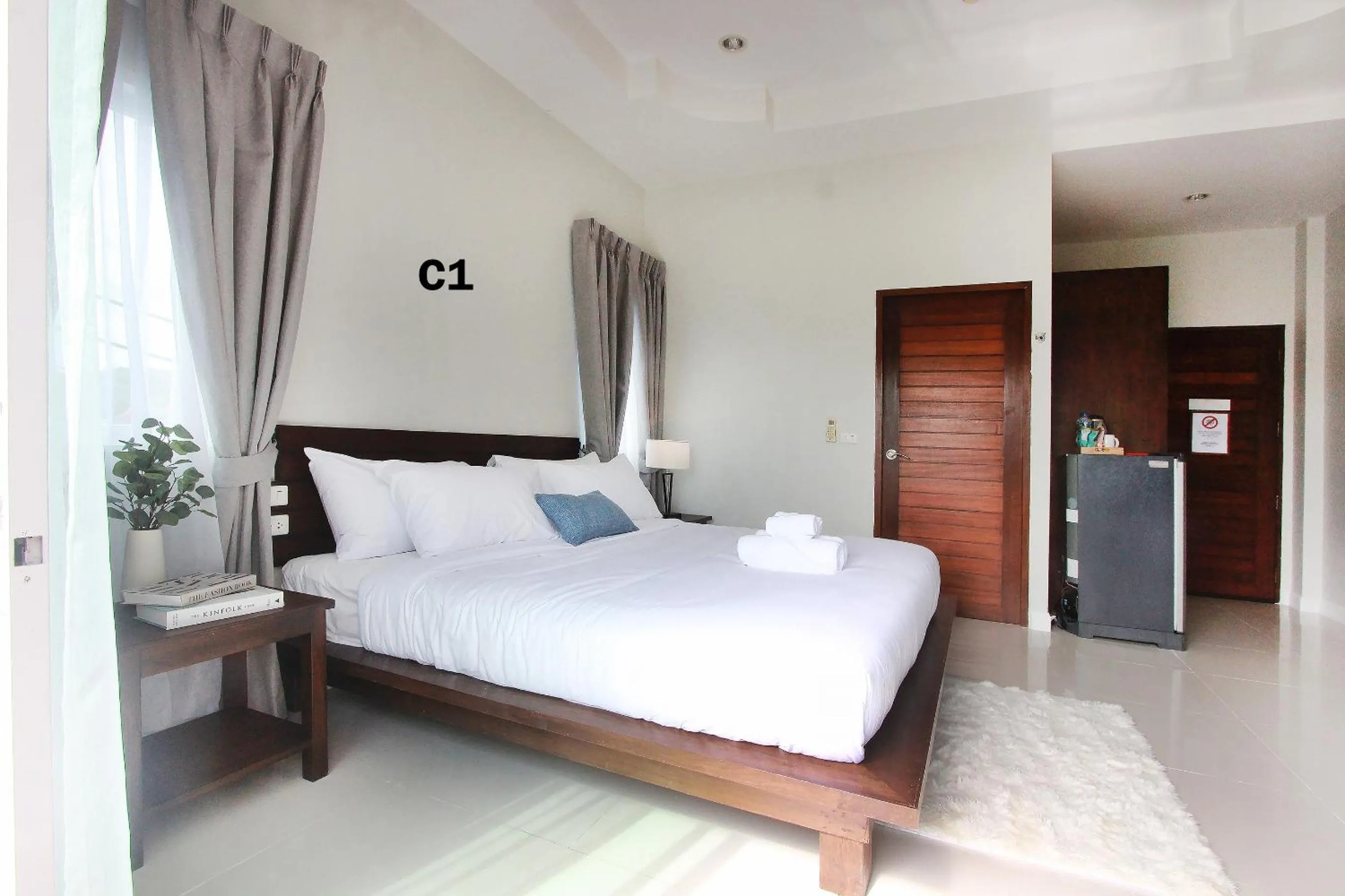 Bed in The Langstan Suites