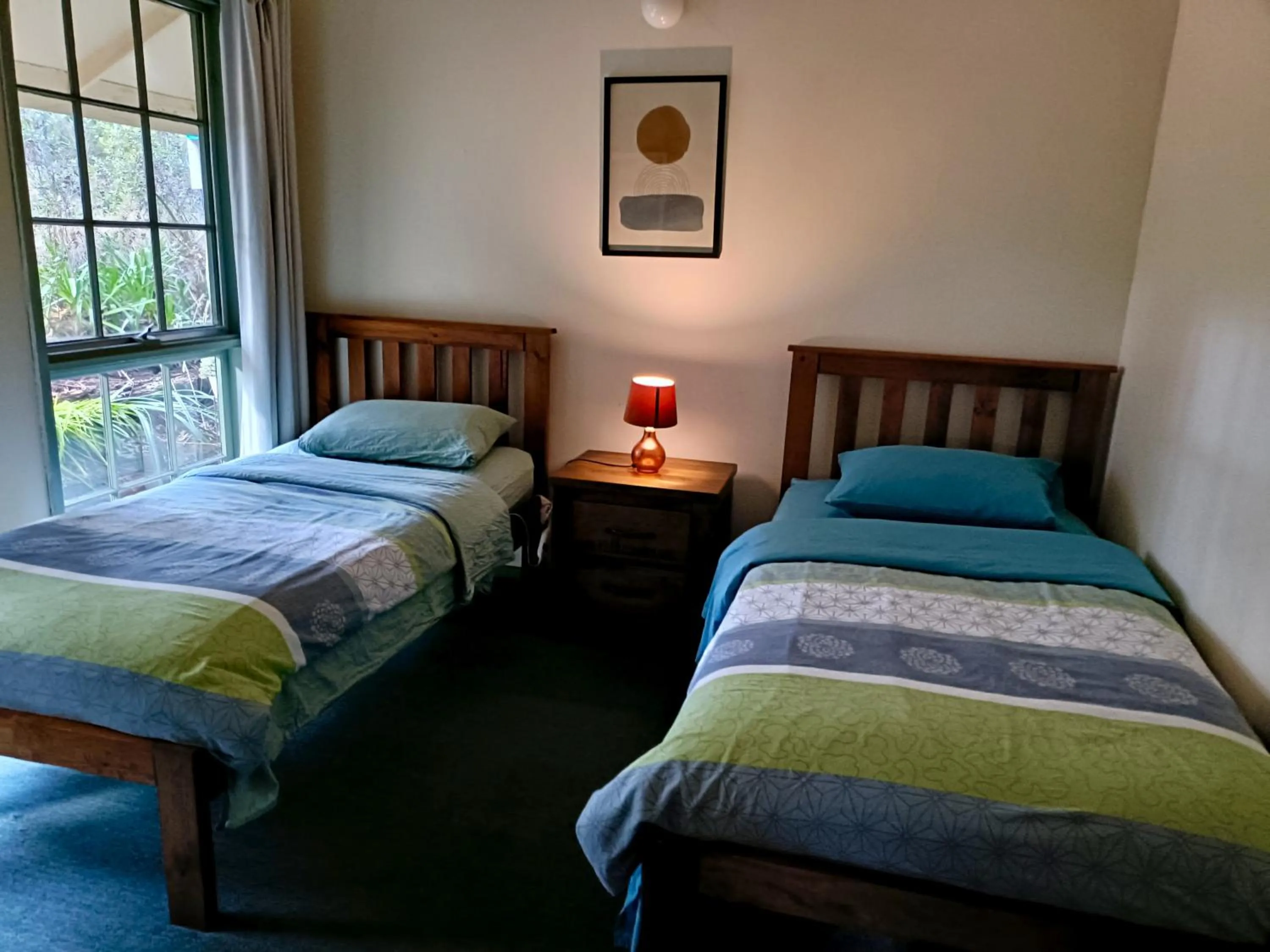 Bed in Kalimna Woods Cottages
