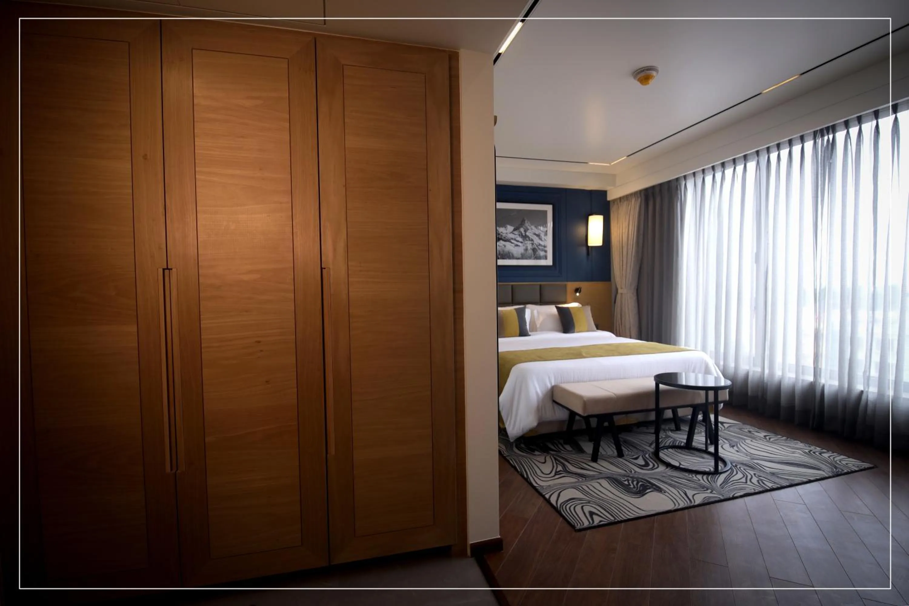 Photo of the whole room, Bed in Ramada Encore by Wyndham Siliguri Sevoke Road