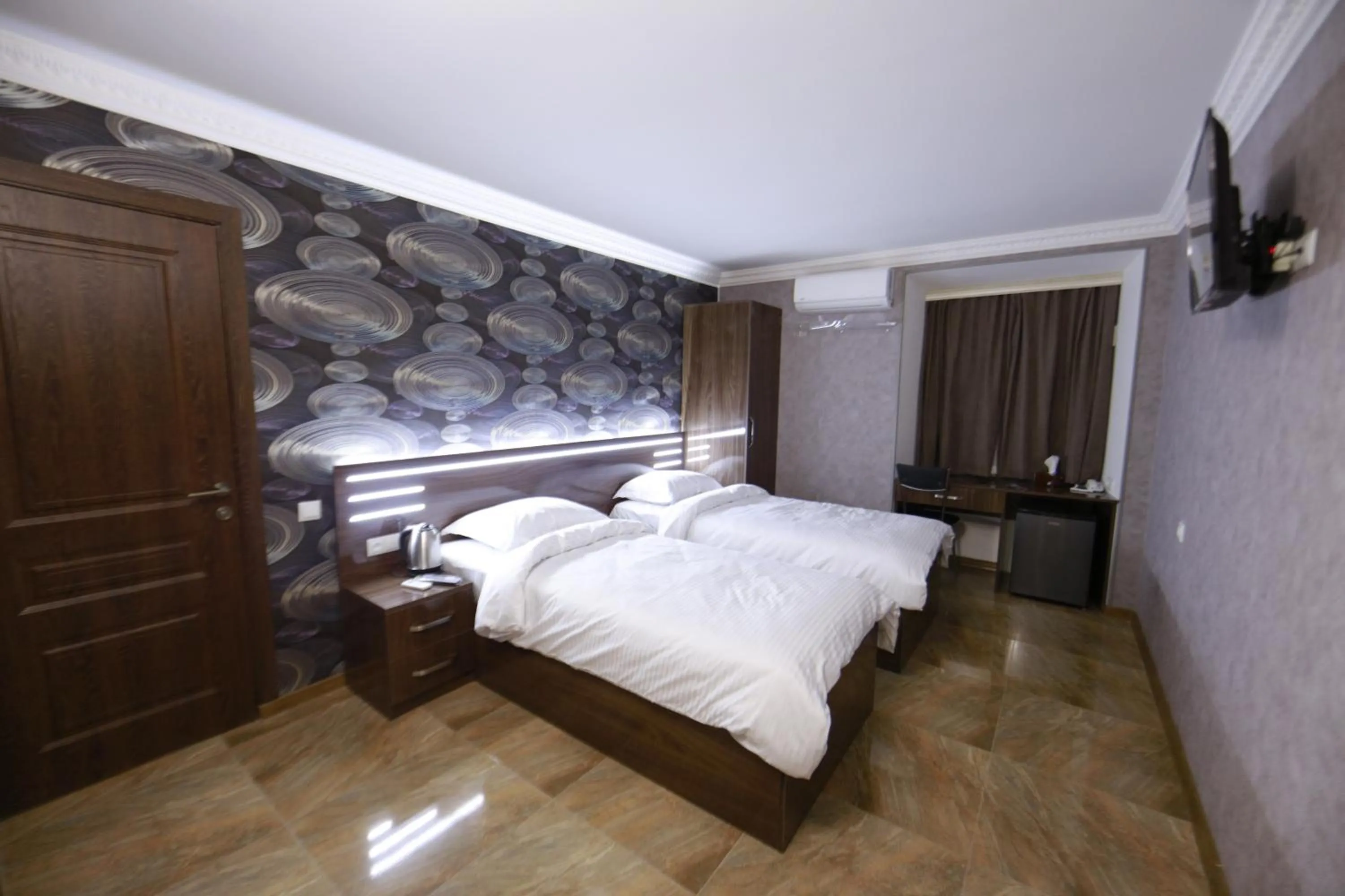 Bed in Opera Avenue Hotel