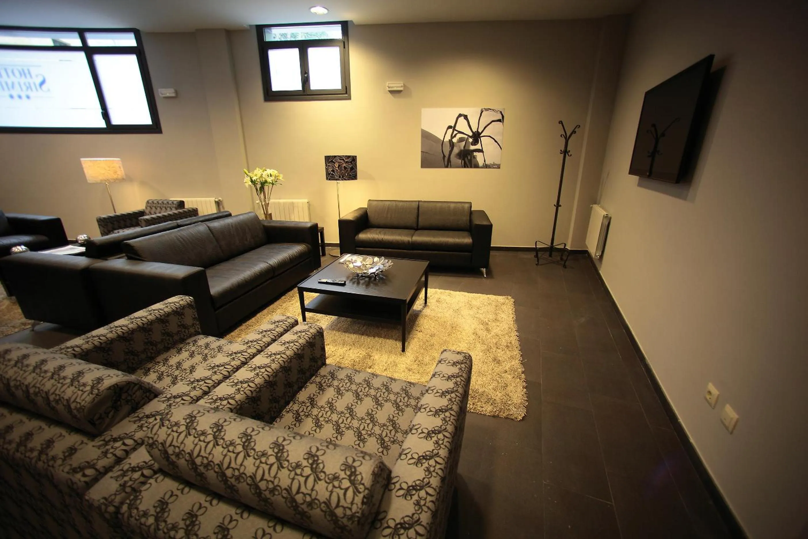 Communal lounge/ TV room, Bed in Hotel Silken Sirimiri