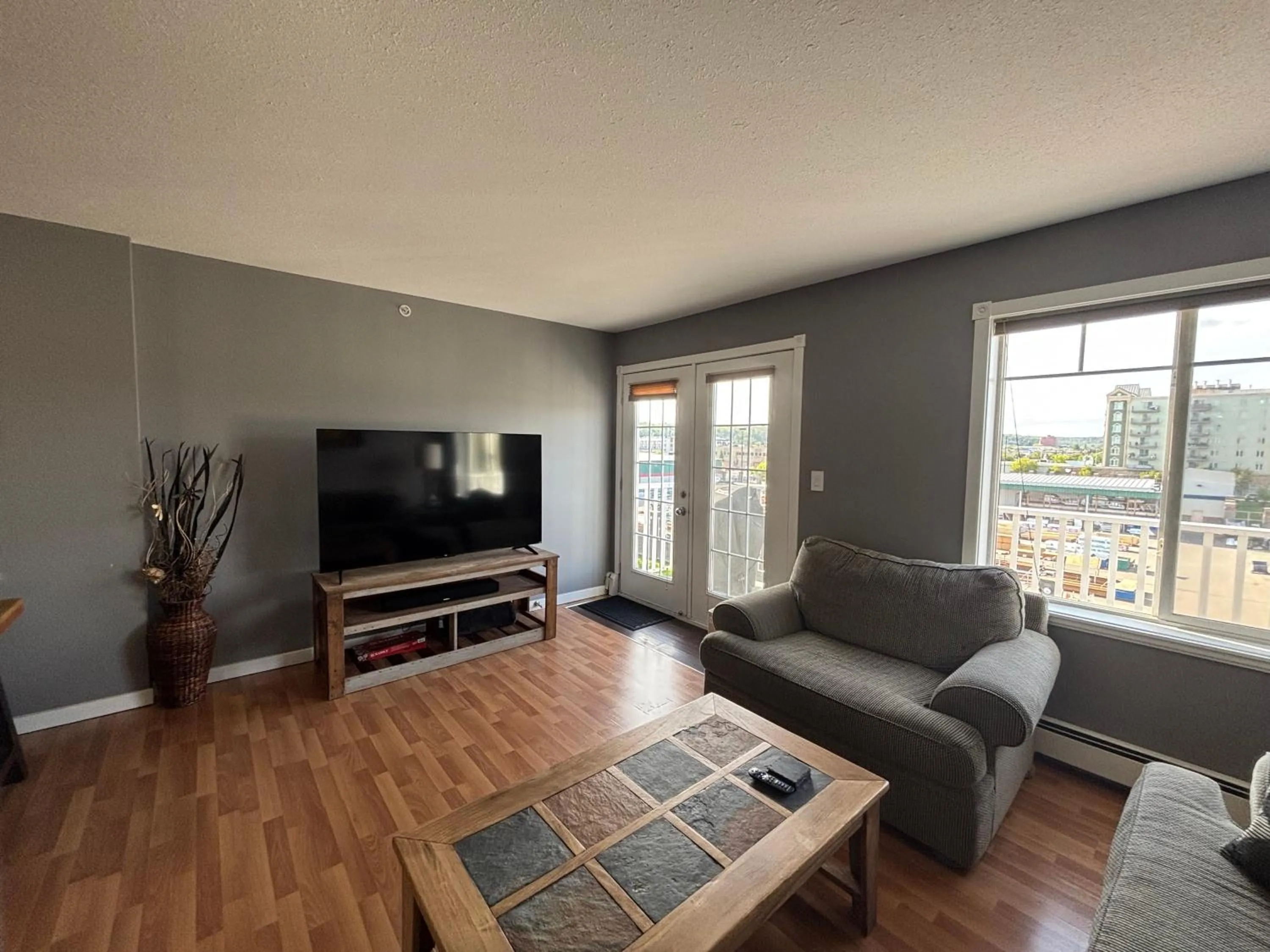 Living room in Top Floor Riverfront Condo with Stellar Sunsets!