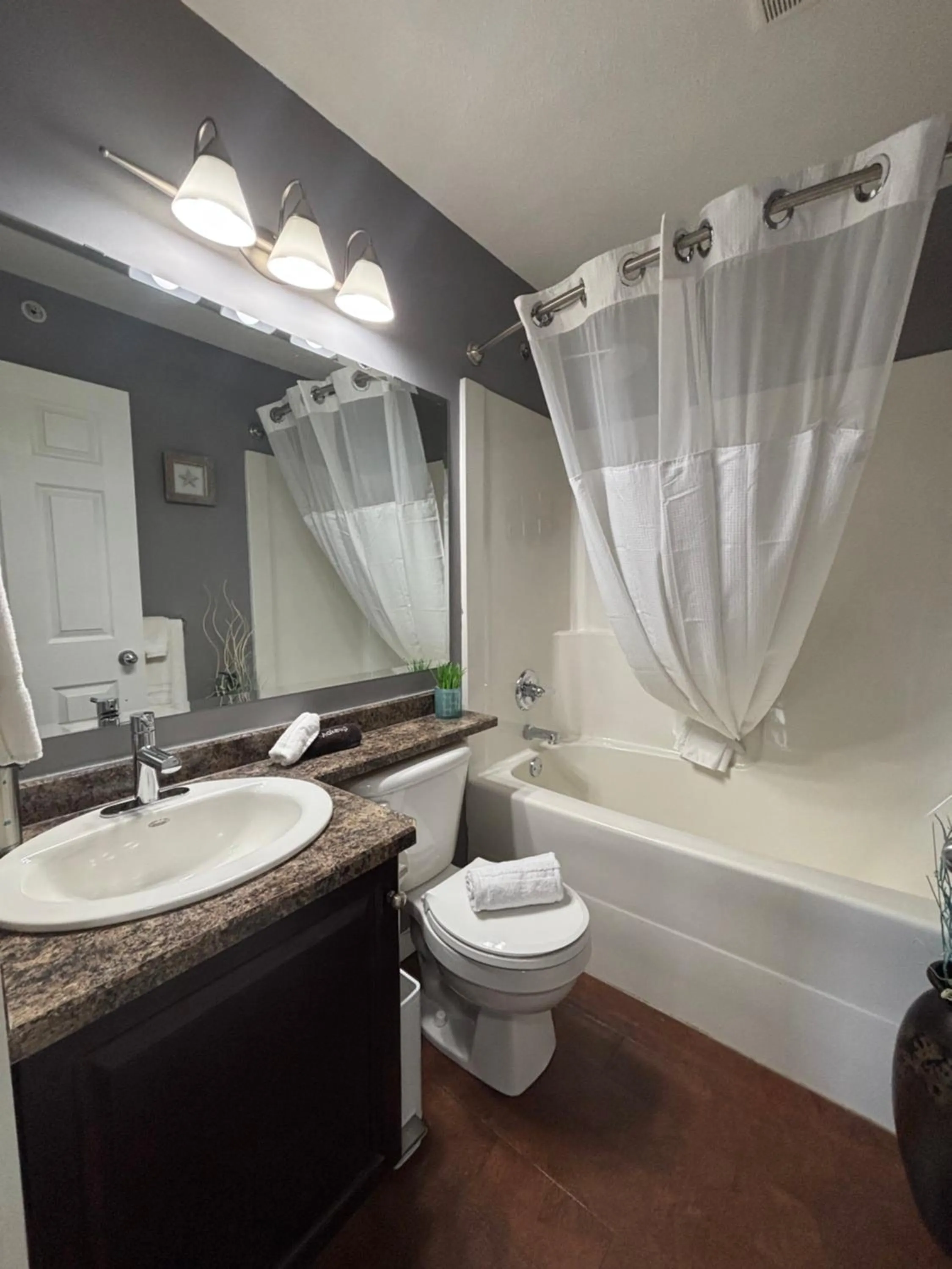 Bathroom in Top Floor Riverfront Condo with Stellar Sunsets!