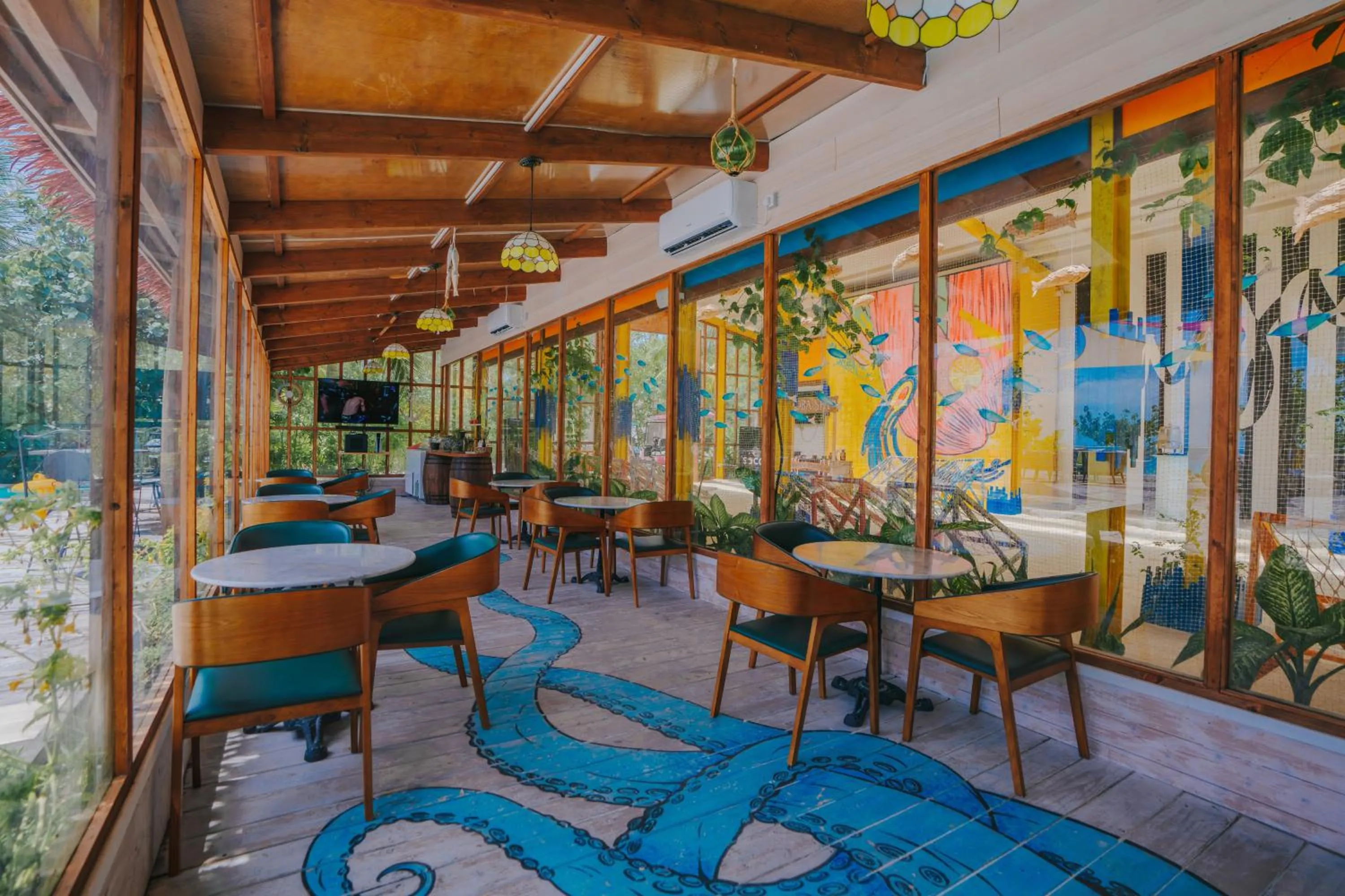 Communal lounge/ TV room in Oaga Art Resort Maldives - Greatest All Inclusive Plan with Free Speedboat Round-trip