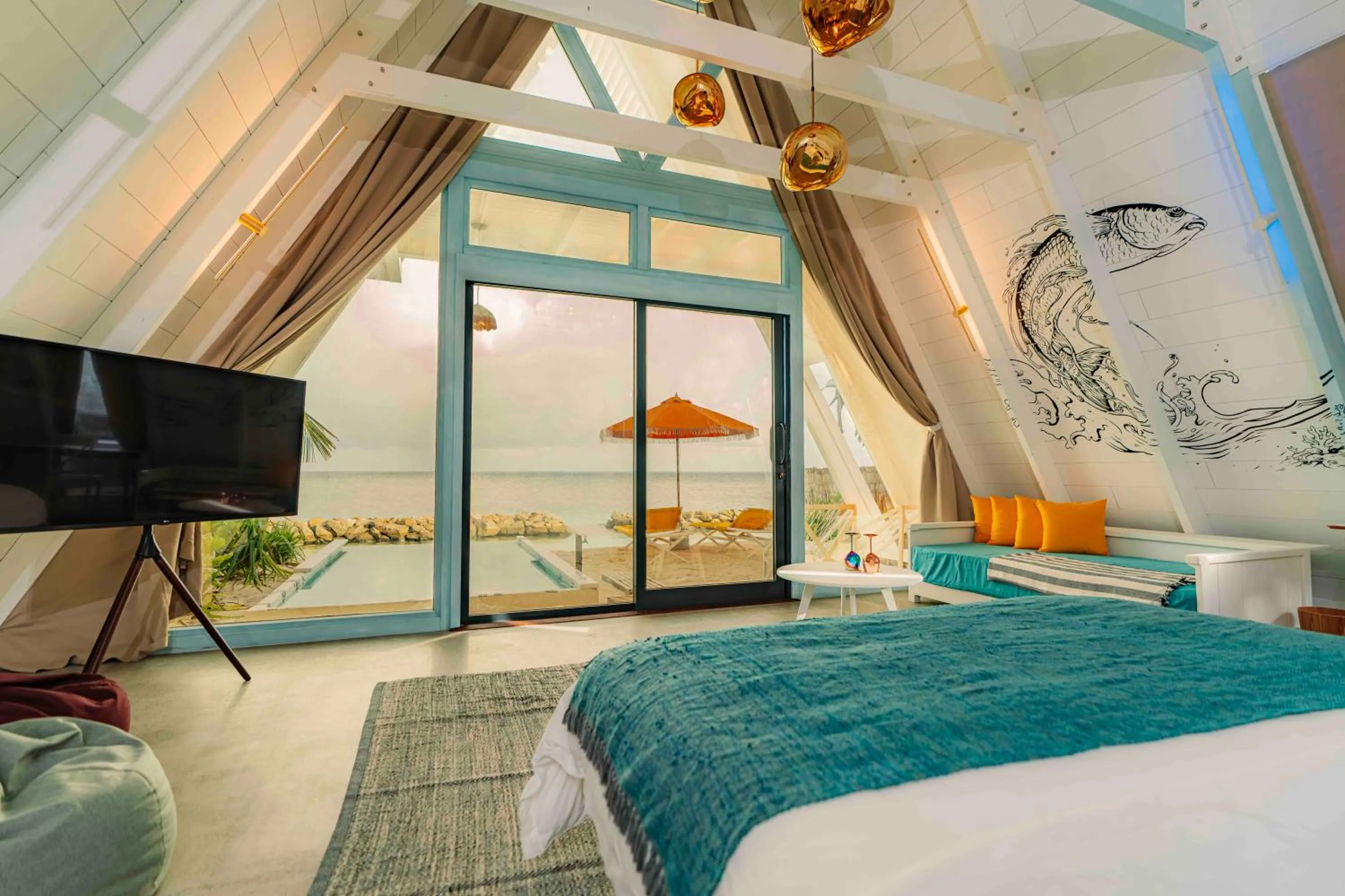 Seating area, Bed in Oaga Art Resort Maldives - Greatest All Inclusive Plan with Free Speedboat Round-trip