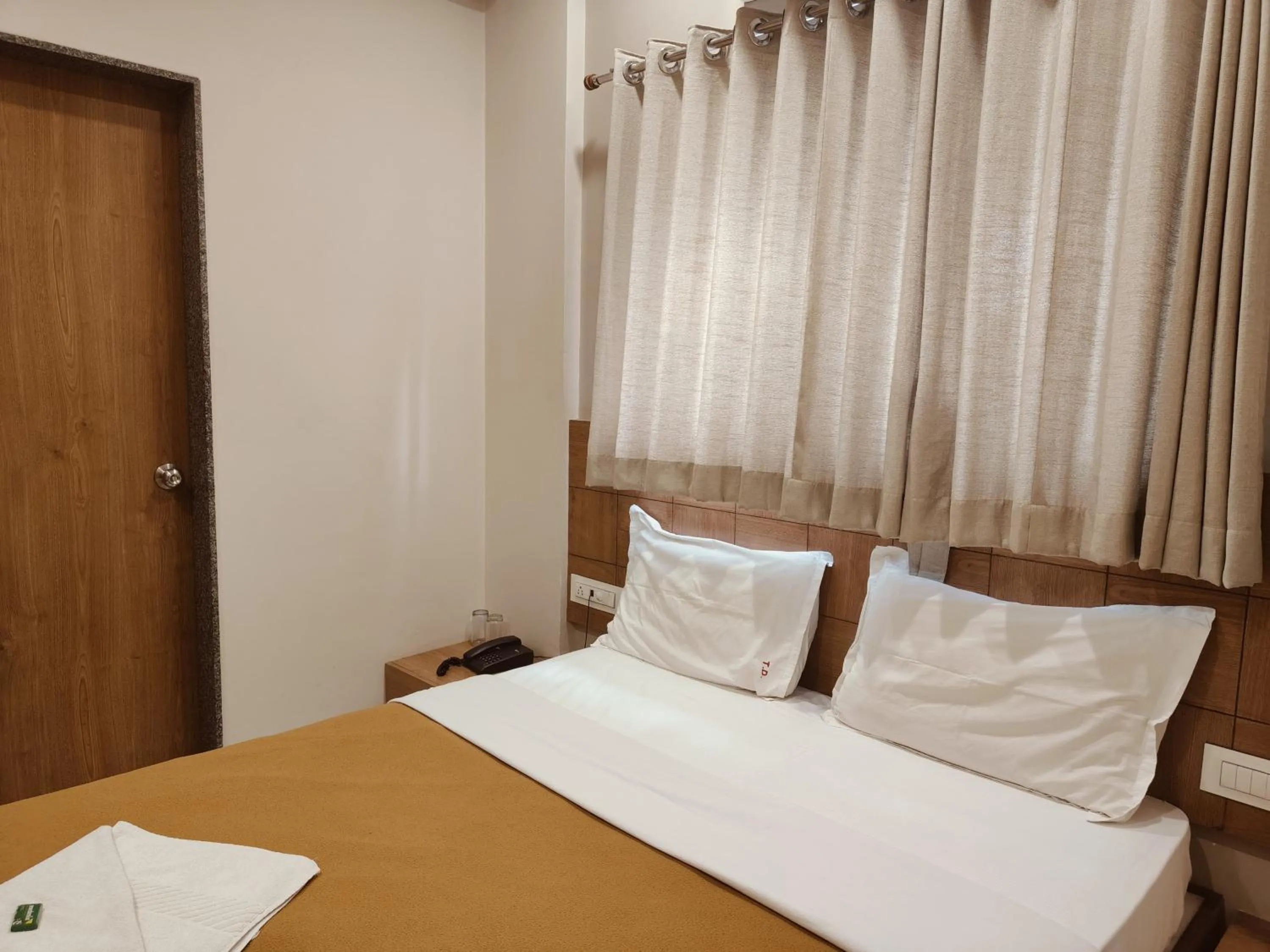 Bed in Hotel TrushaDham Near to Mahalaxmi Temple Kolhapur