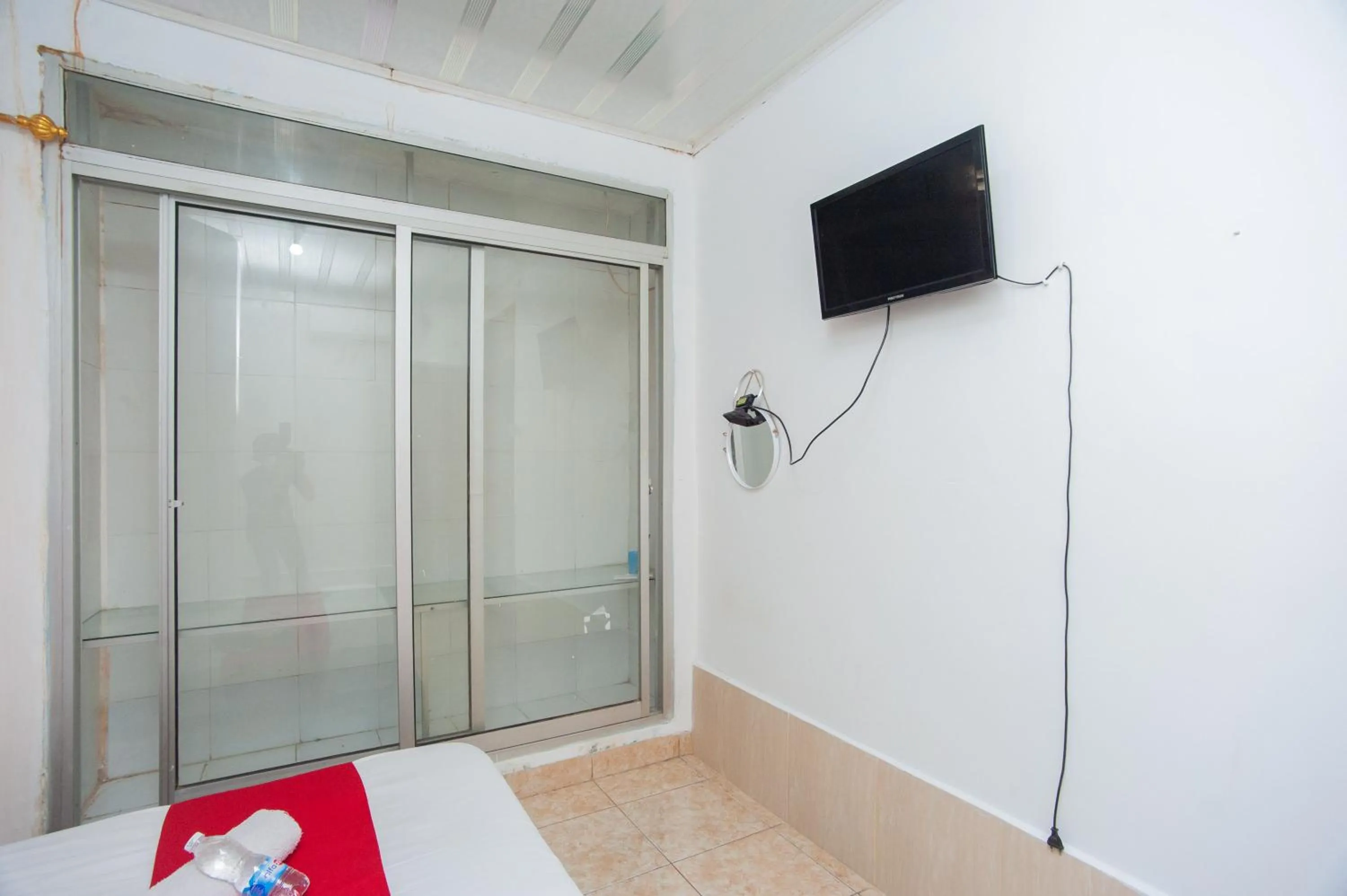 Bedroom in RedDoorz Syariah at Jalan Wayhitam Palembang