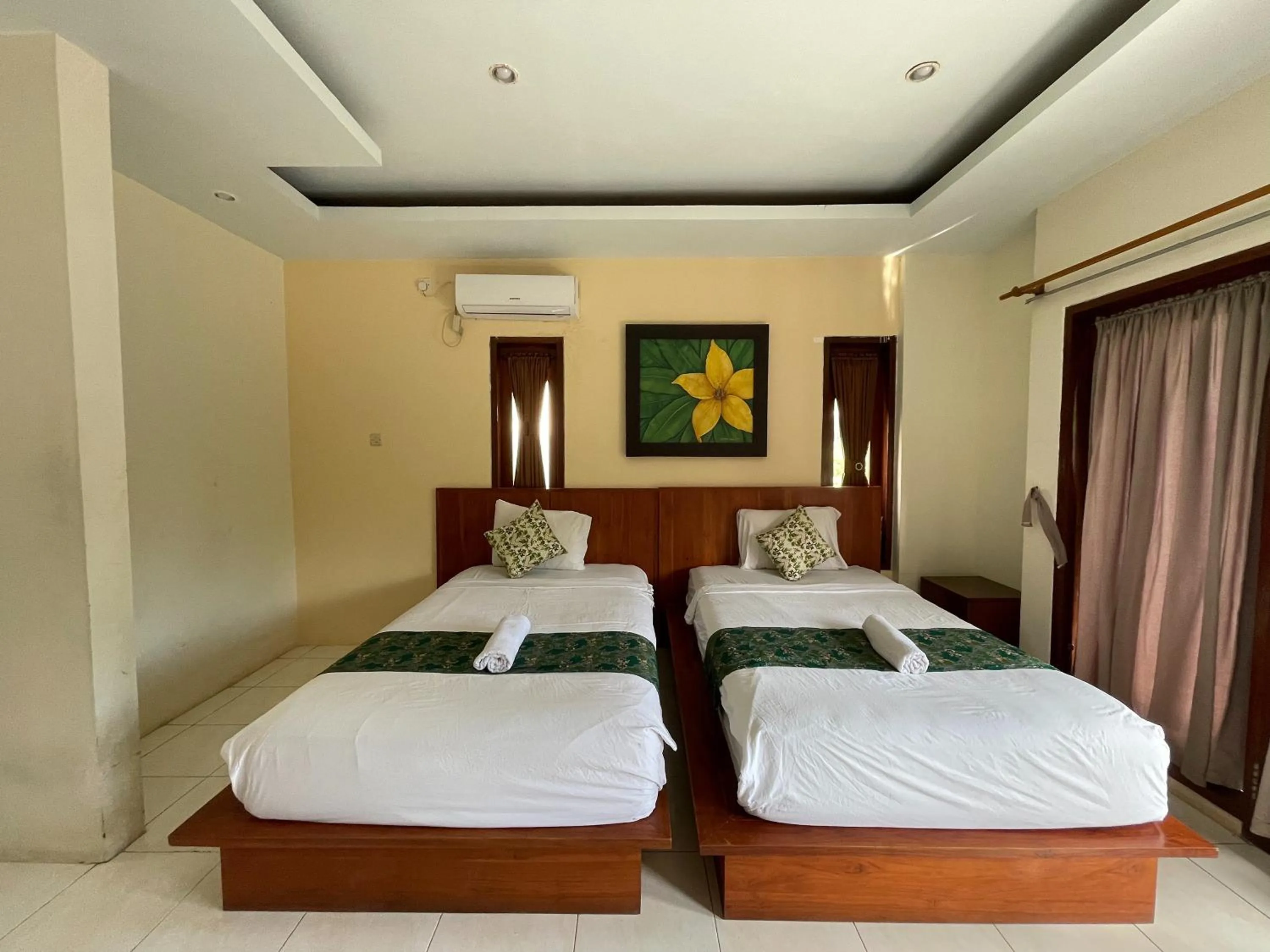 Bed in Melati Resort & Hotel Kuta Lombok