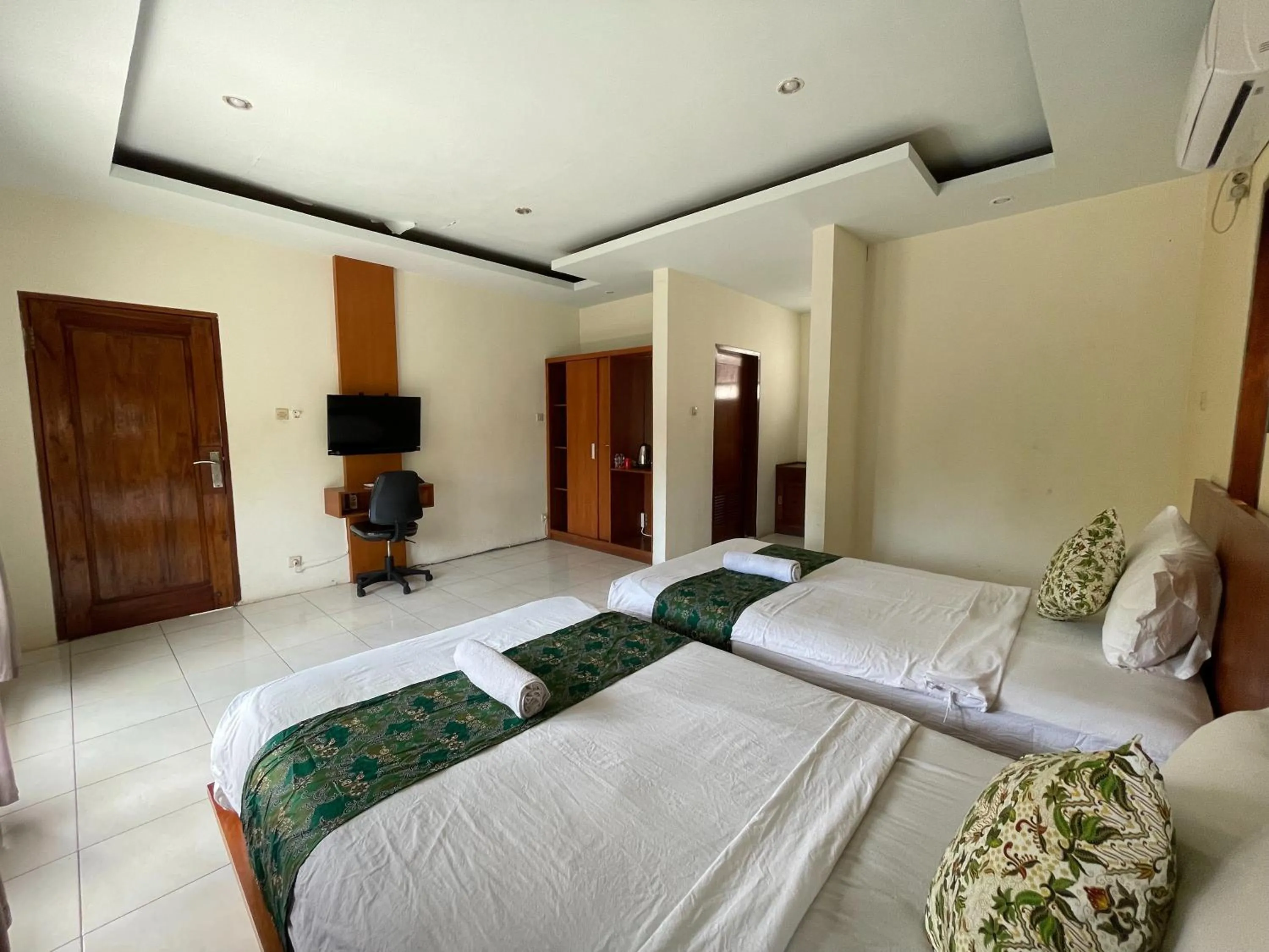 Bed in Melati Resort & Hotel Kuta Lombok