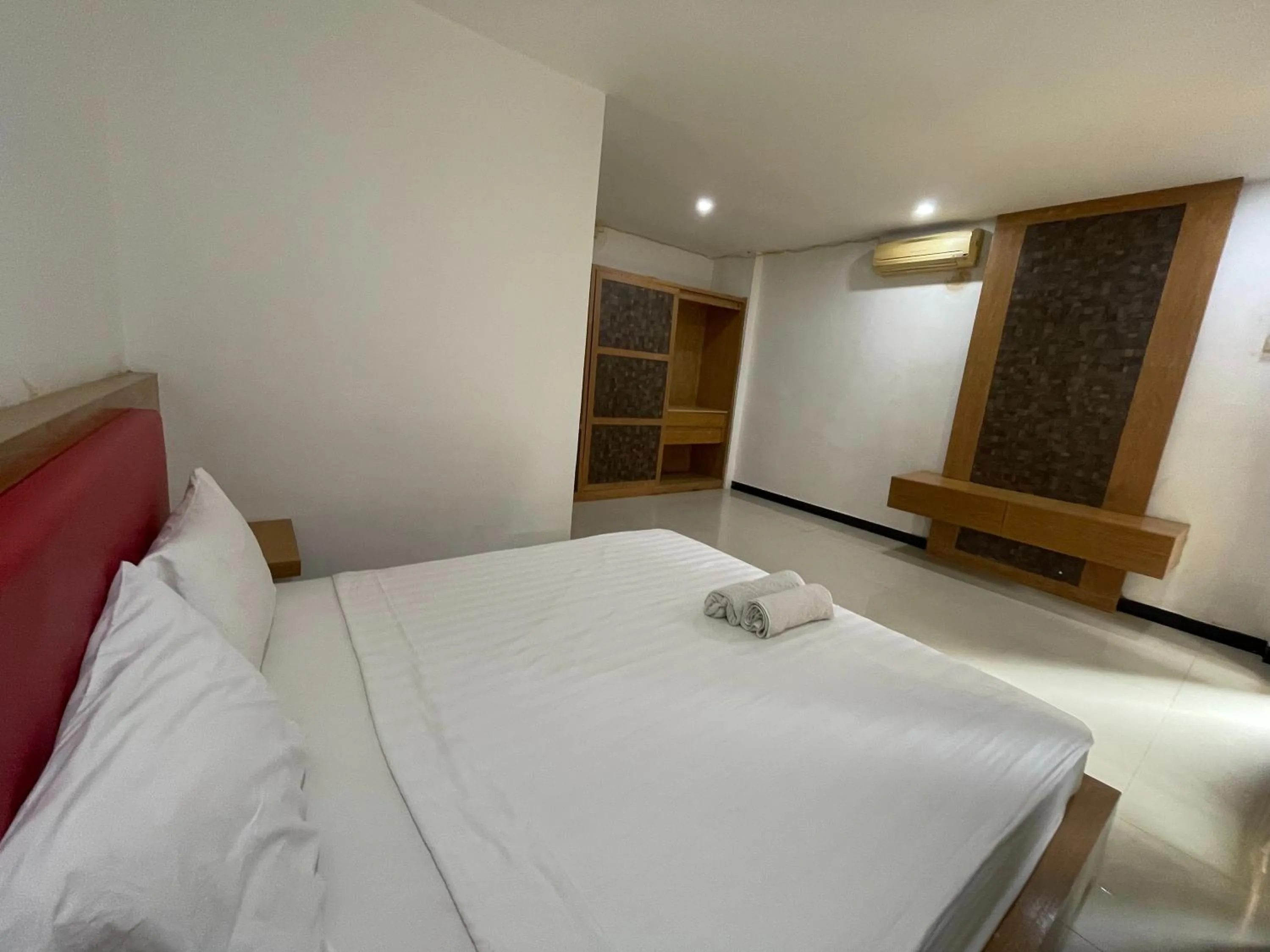 Bed in Melati Resort & Hotel Kuta Lombok