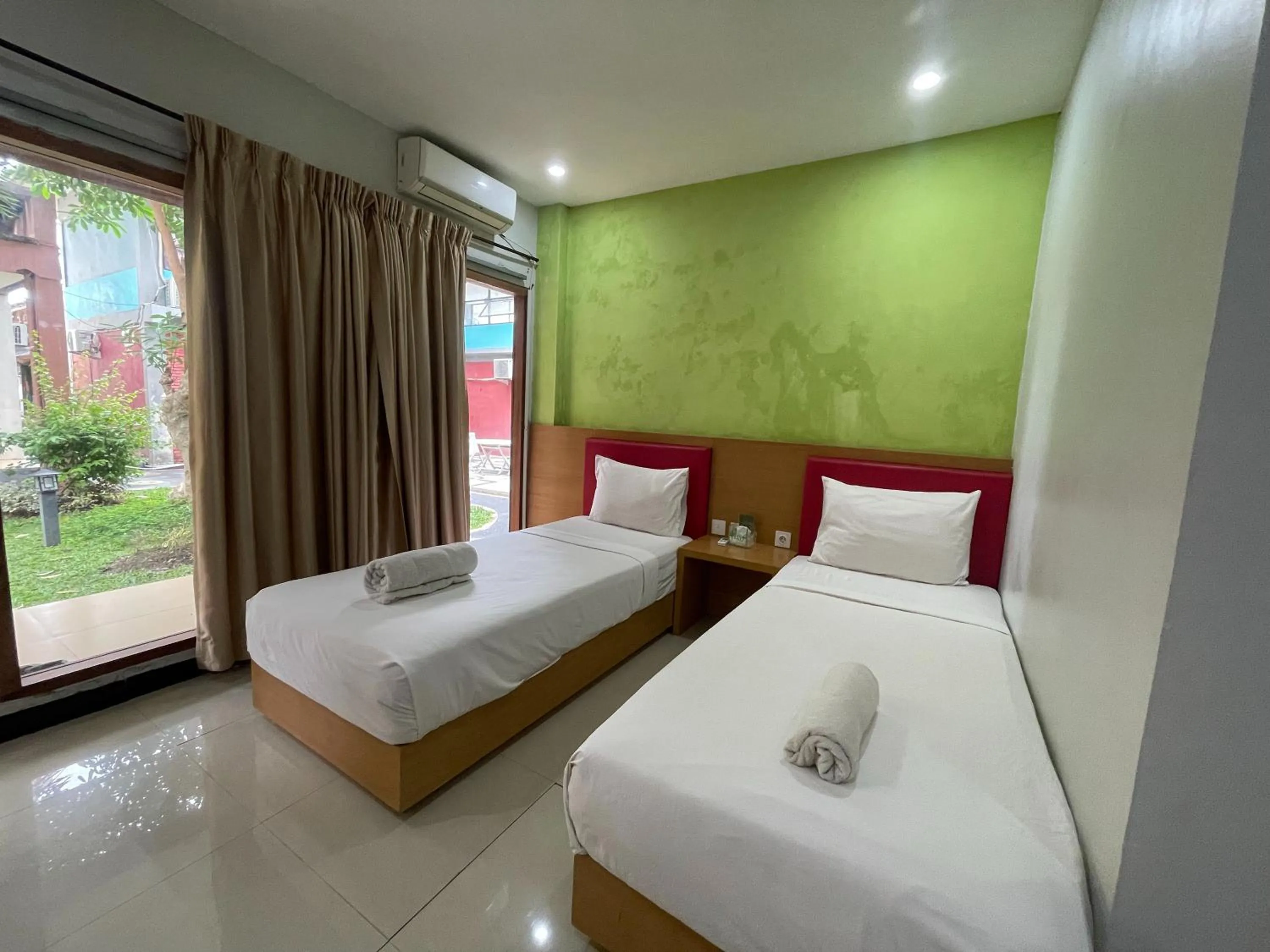 Bed in Melati Resort & Hotel Kuta Lombok