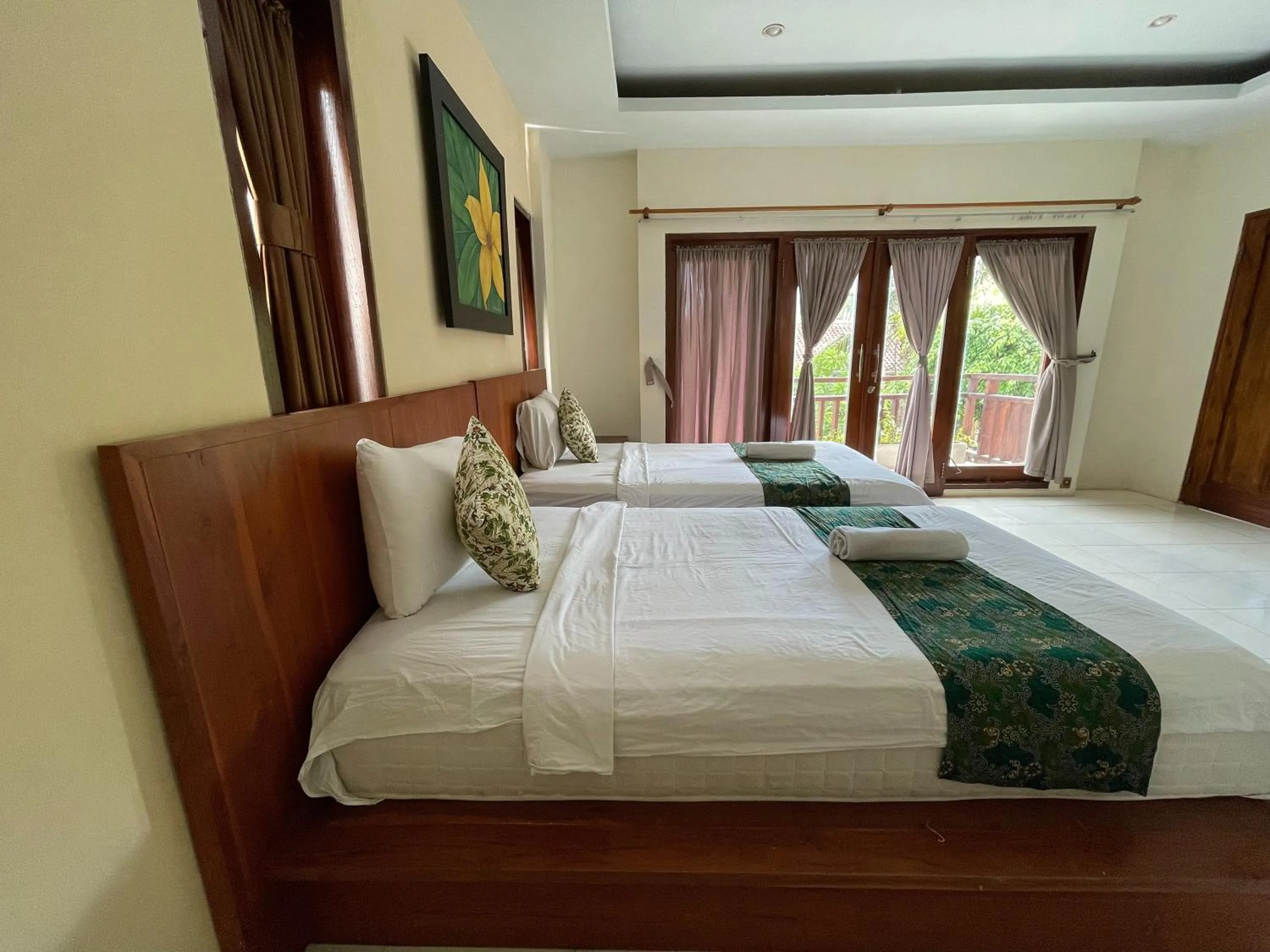 Bed in Melati Resort & Hotel Kuta Lombok