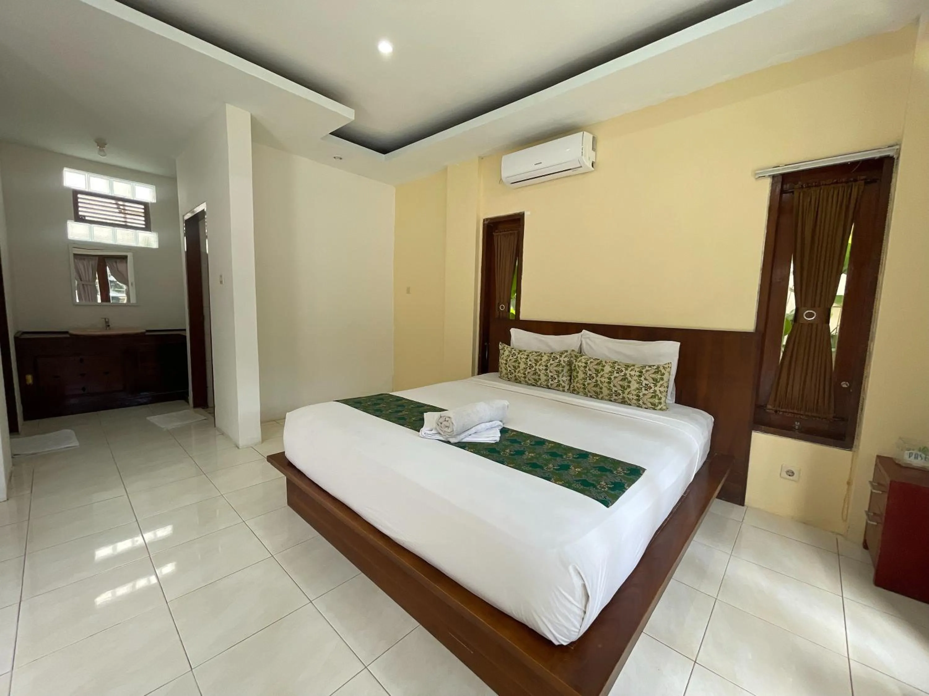 Bed in Melati Resort & Hotel Kuta Lombok