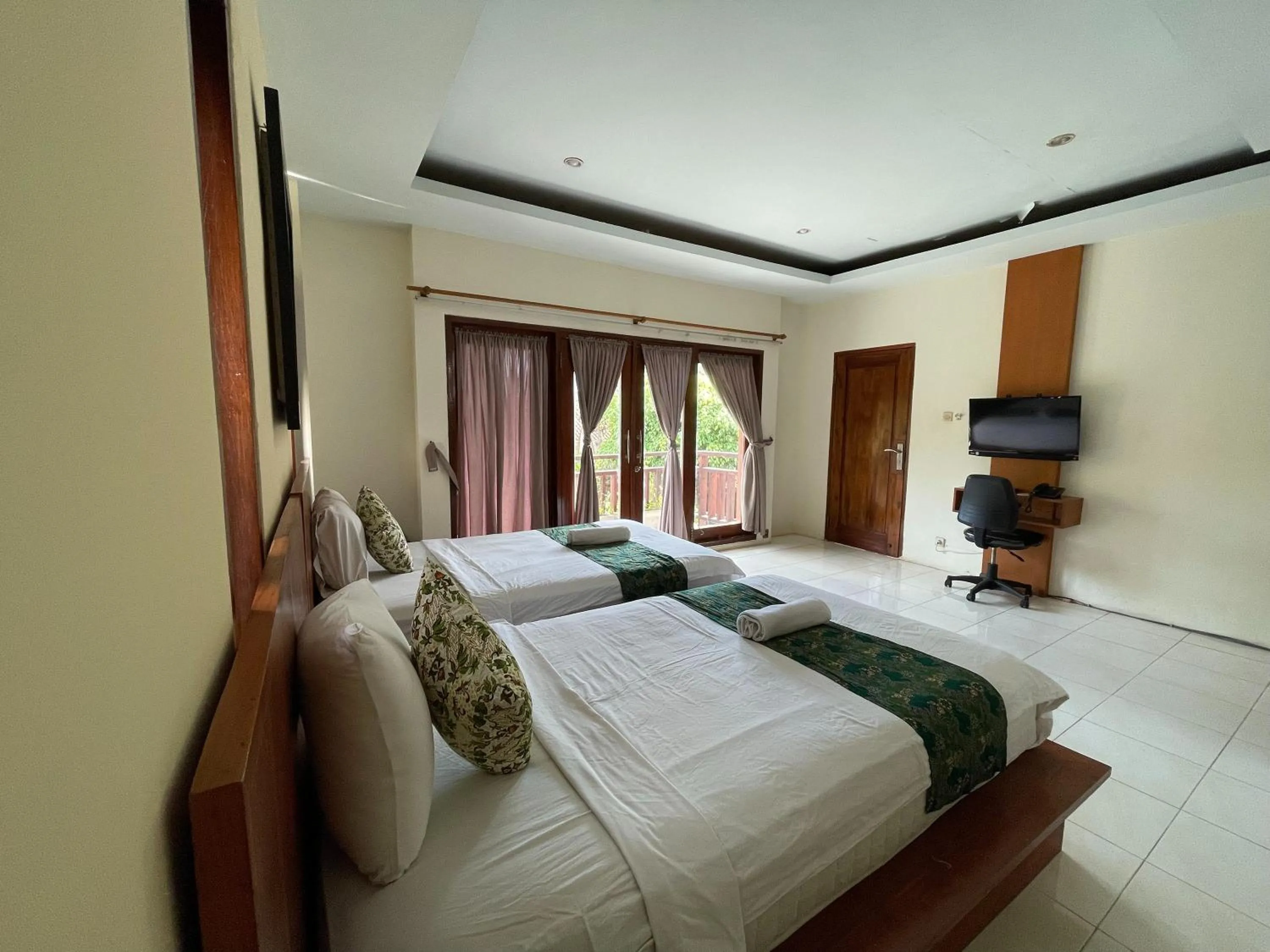 Bed in Melati Resort & Hotel Kuta Lombok
