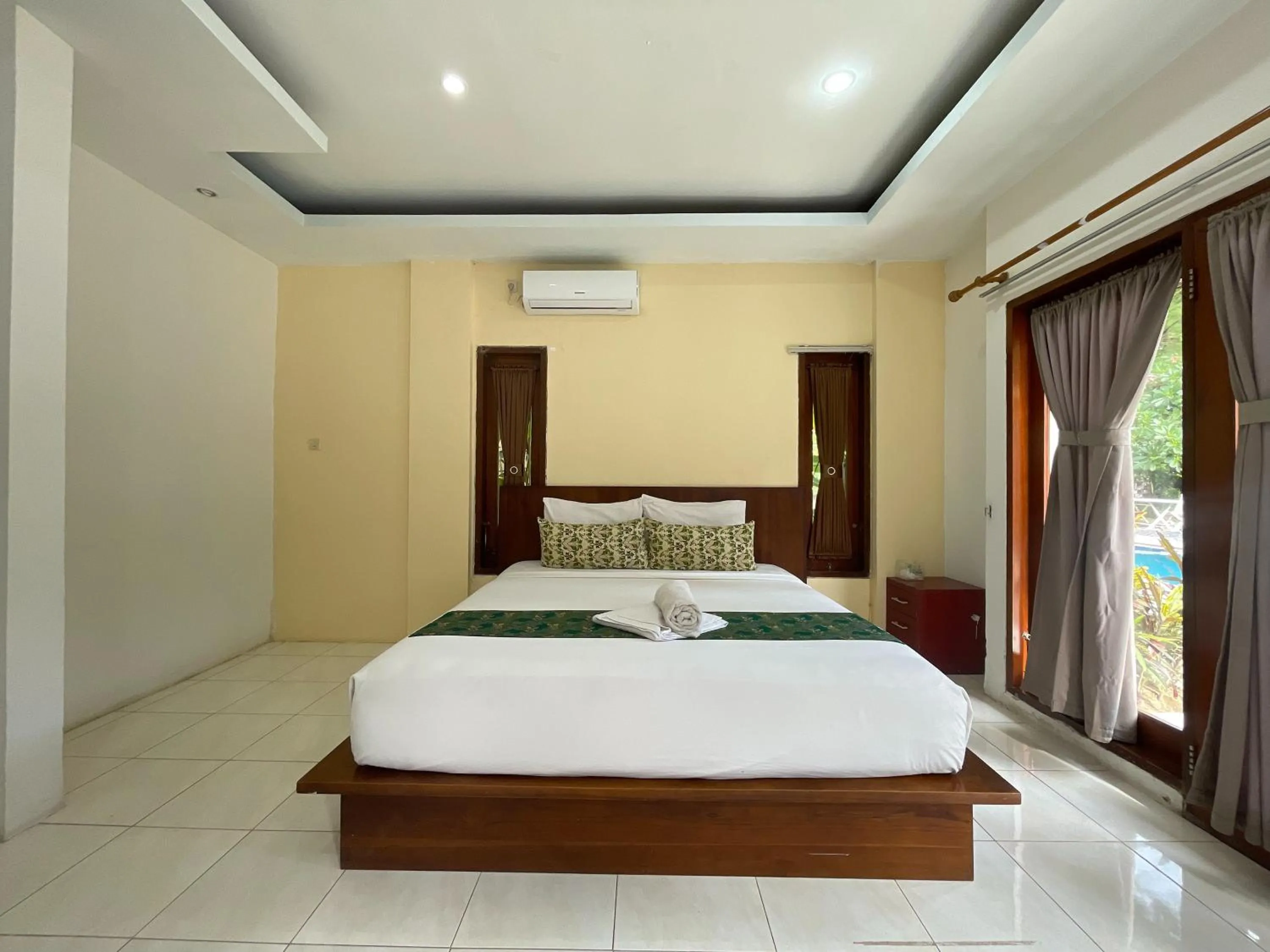 Bed in Melati Resort & Hotel Kuta Lombok