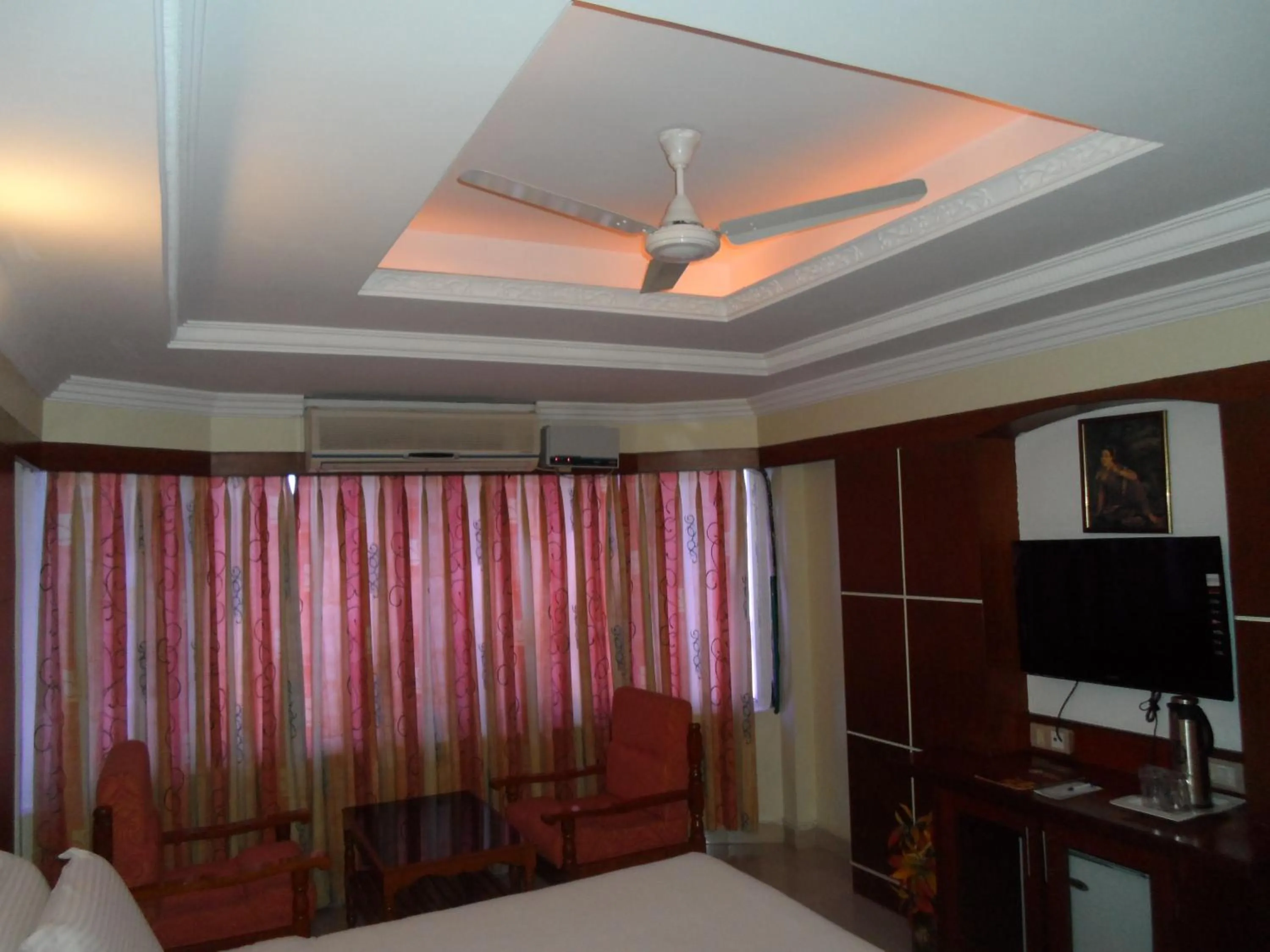 Seating area, Bed in Hotel PLR Grand