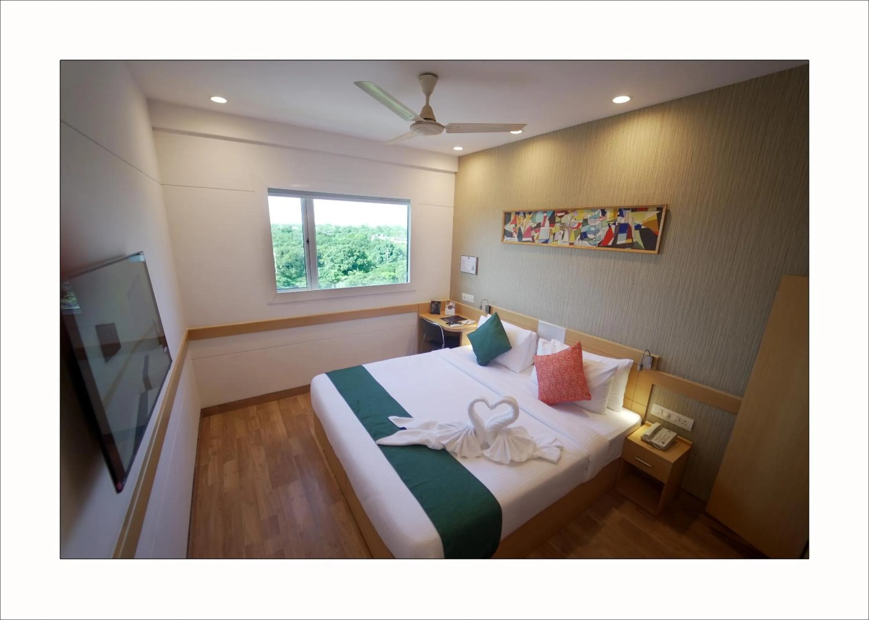 Bed in Mango Grove Hotel