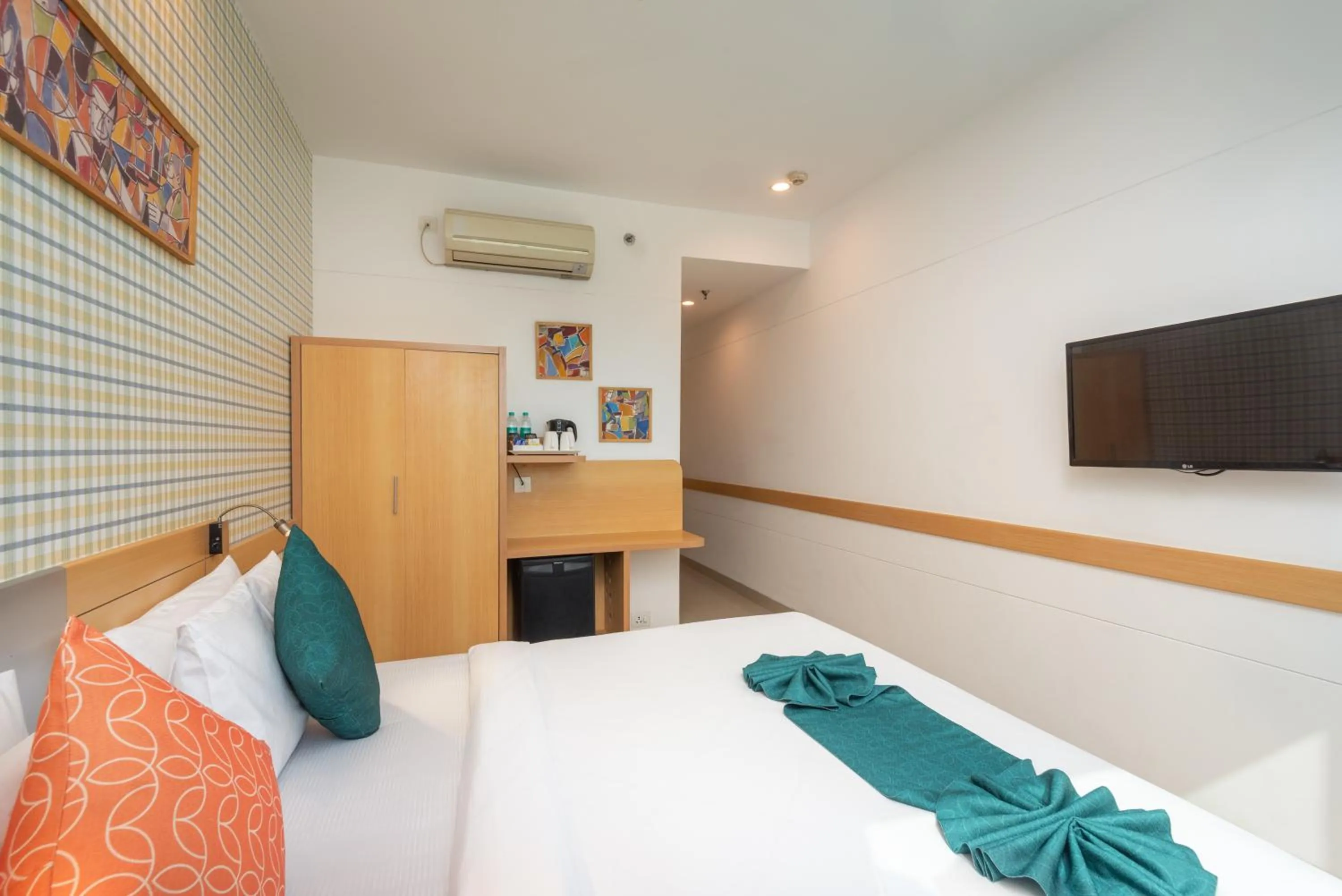 Bed in Mango Grove Hotel