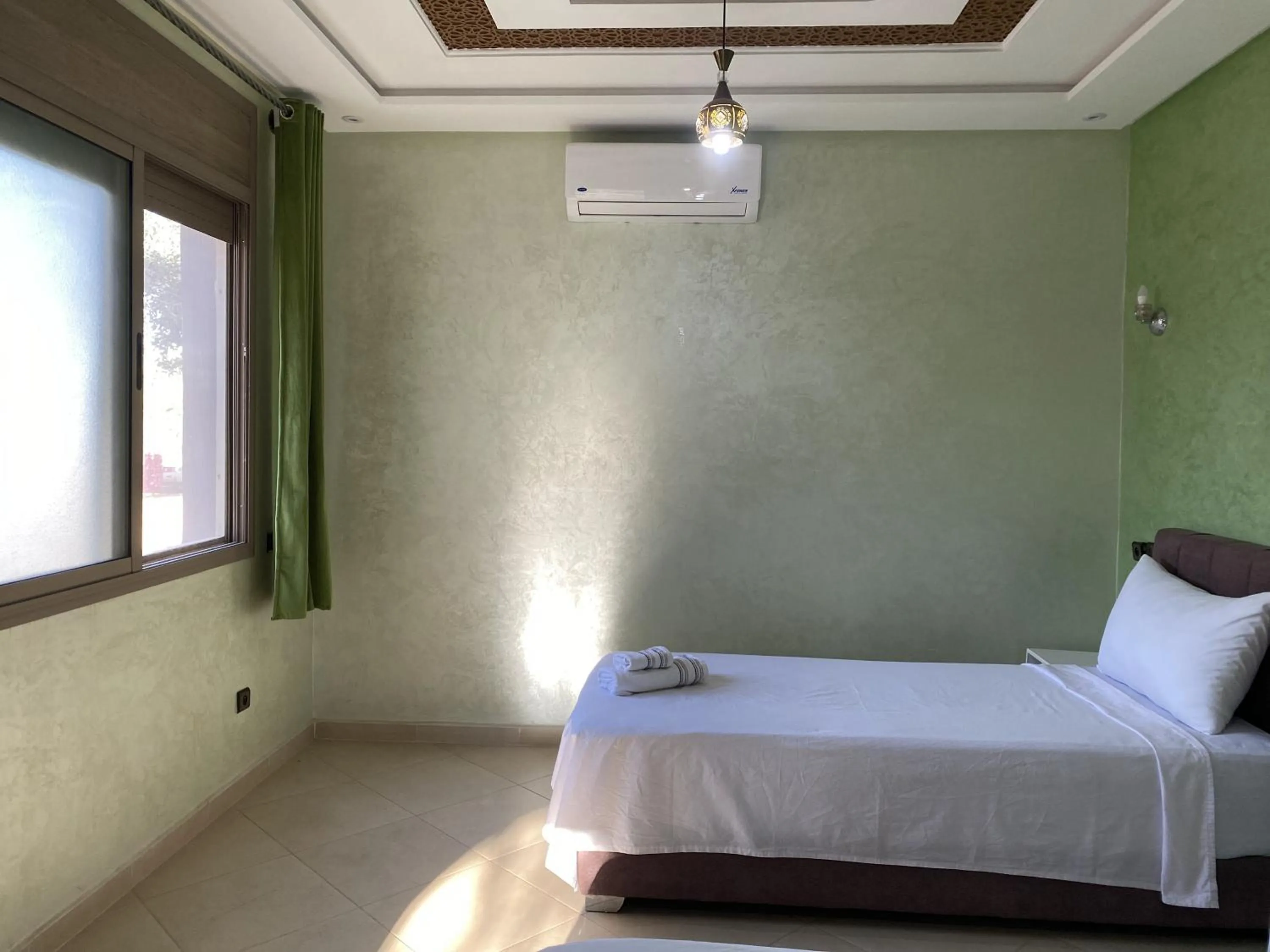 air conditioner, Bed in IGHIZ INN resort