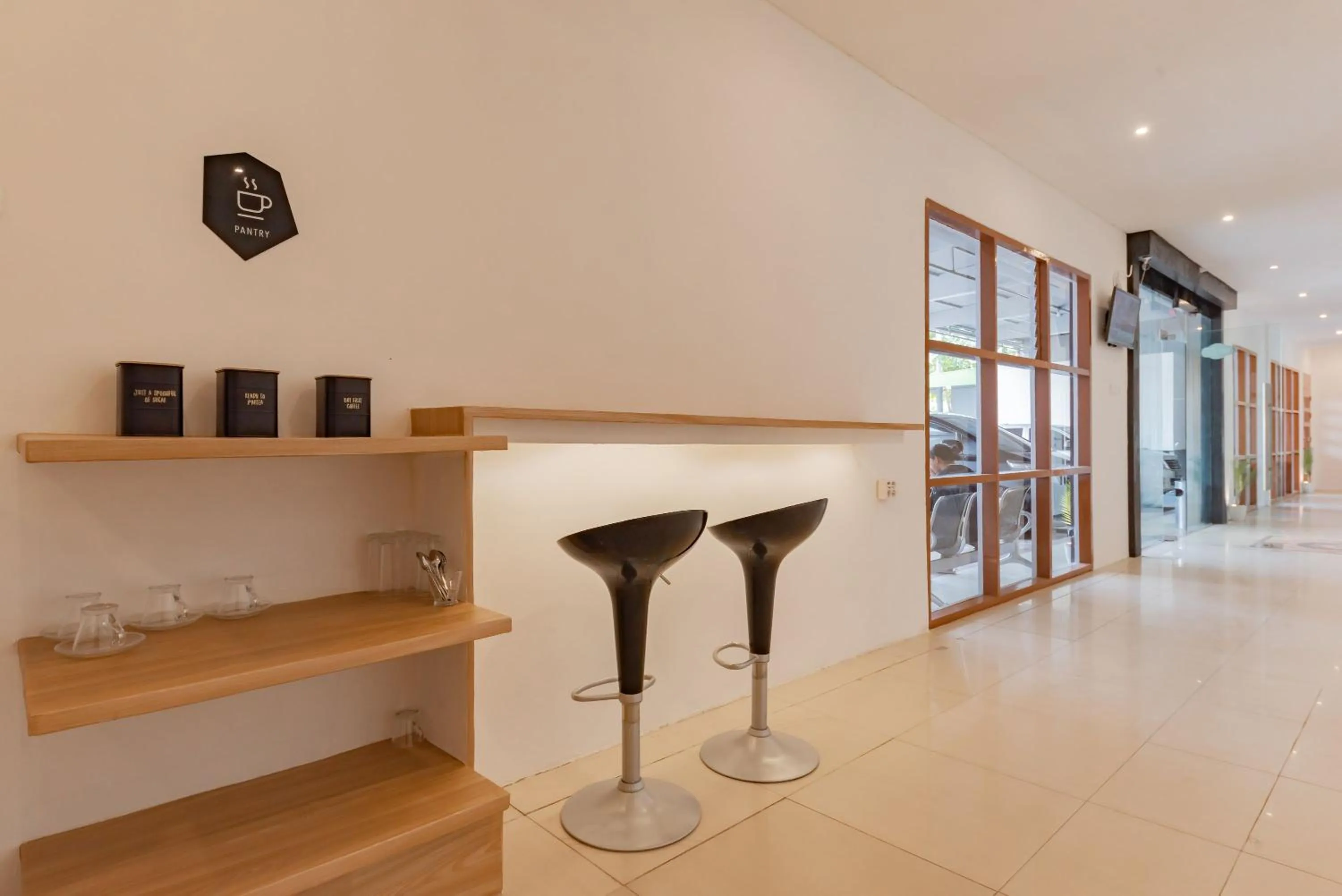 Seating area in Urbanview Hotel Cozy Samarinda by RedDoorz