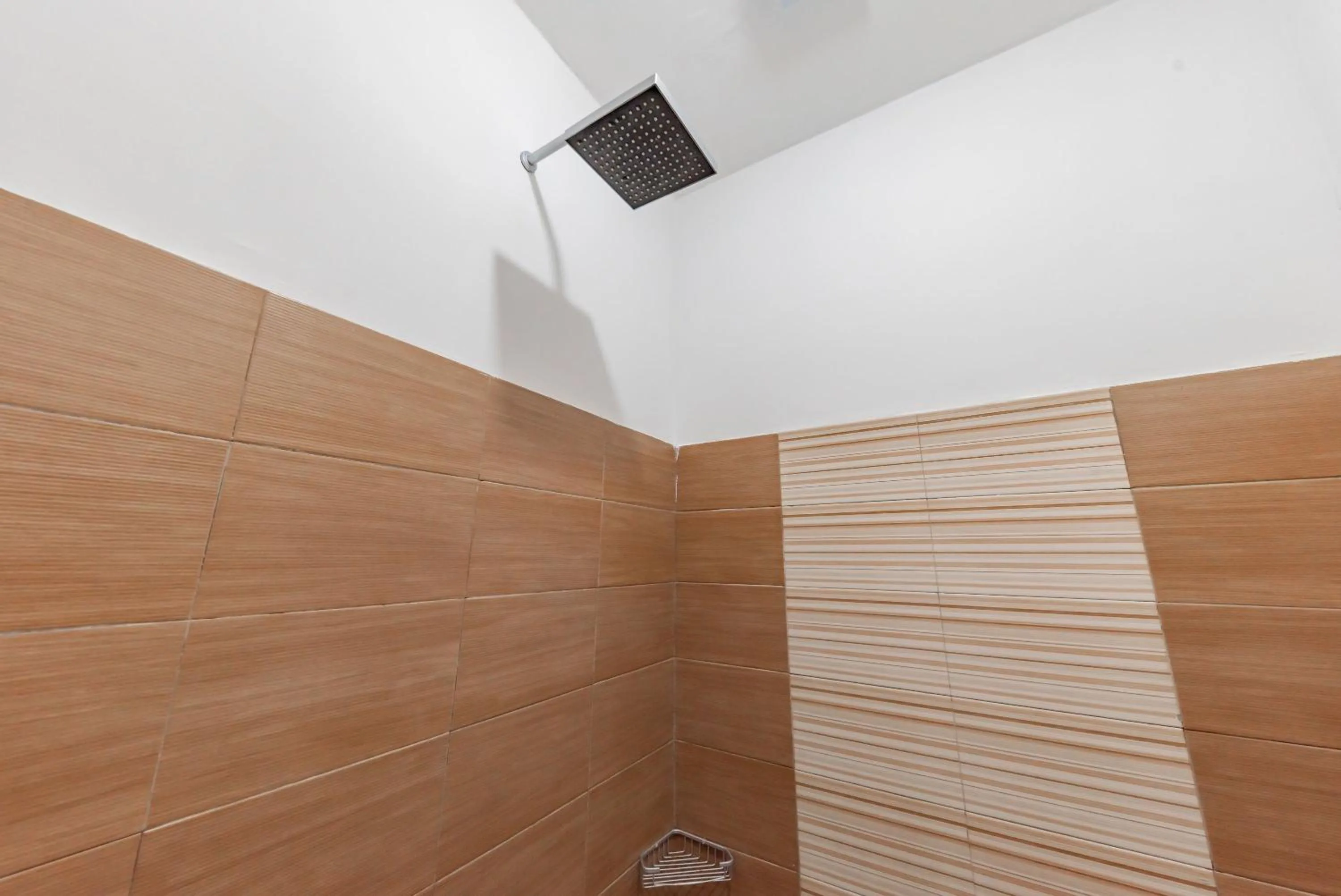 Bathroom in Urbanview Hotel Cozy Samarinda by RedDoorz