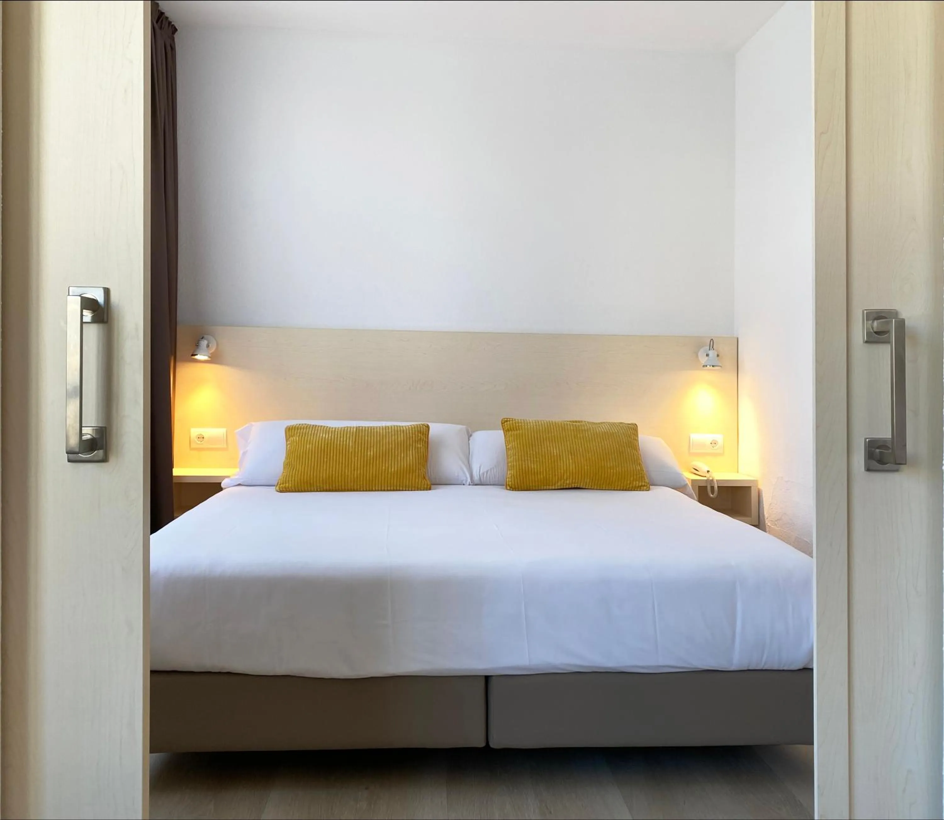 Bed in Atenea Park Suites & Apartments