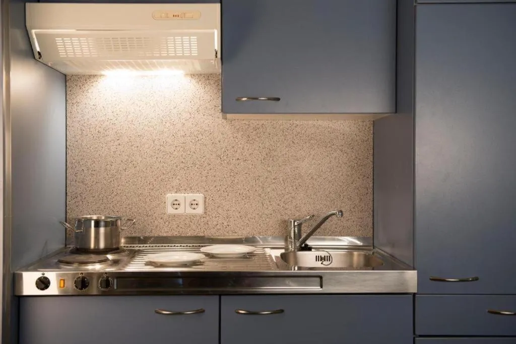 Kitchen or kitchenette in 24hours Apartment Hotel