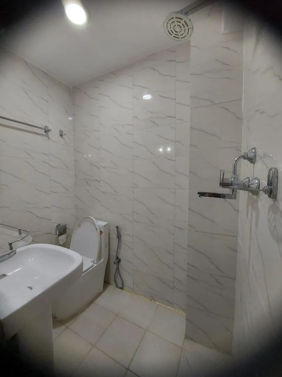 Bathroom in Om Bramha Hotel