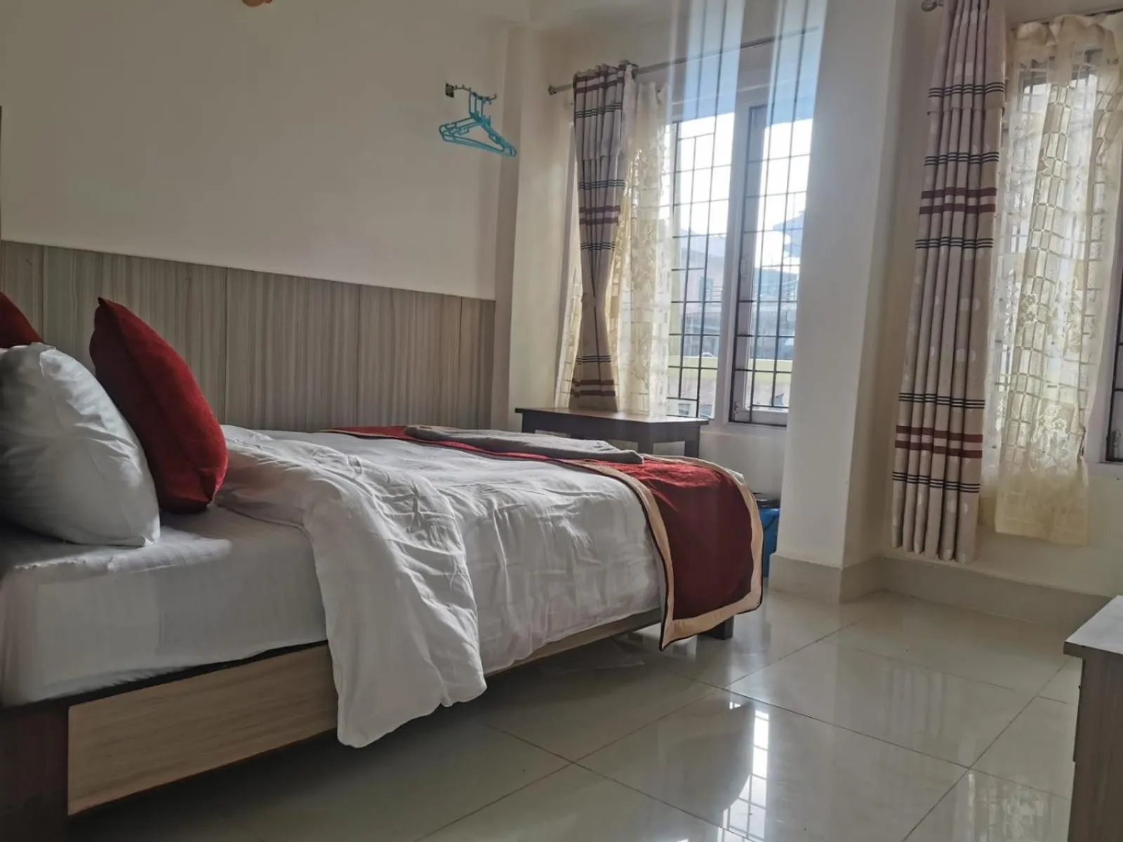 Photo of the whole room, Bed in Om Bramha Hotel