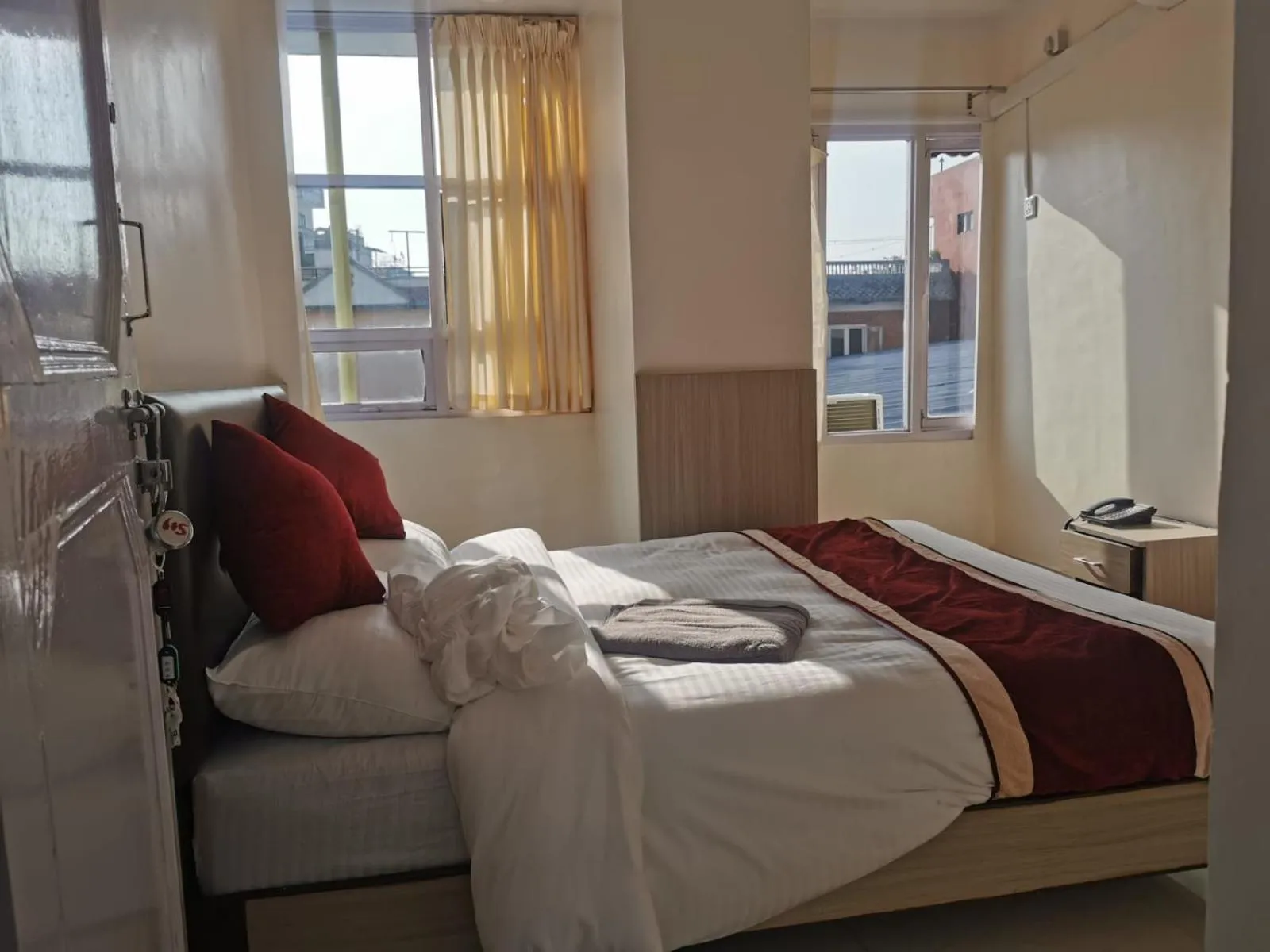 Photo of the whole room, Bed in Om Bramha Hotel