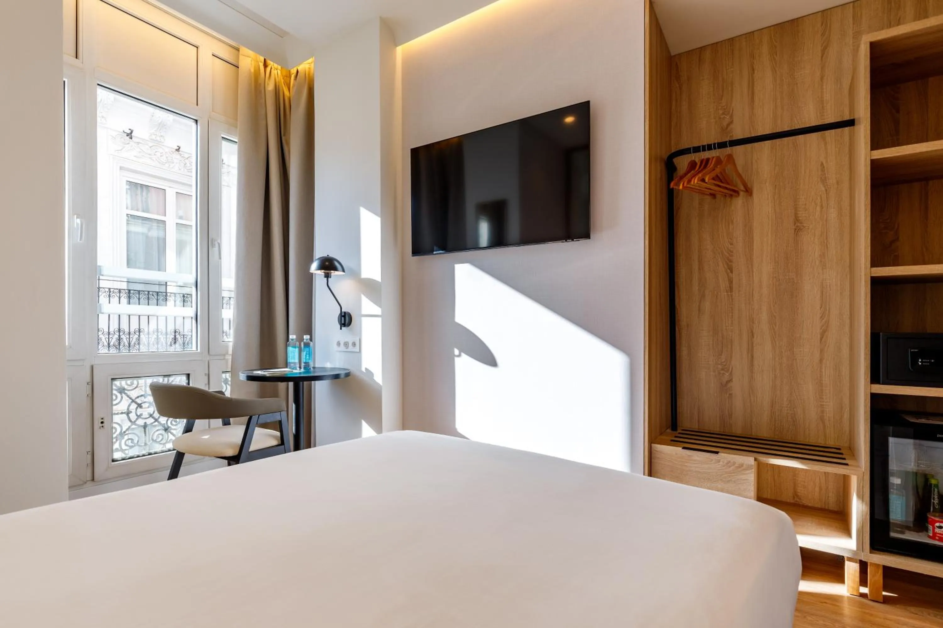 Bed in Petit Palace Plaza de la Reina