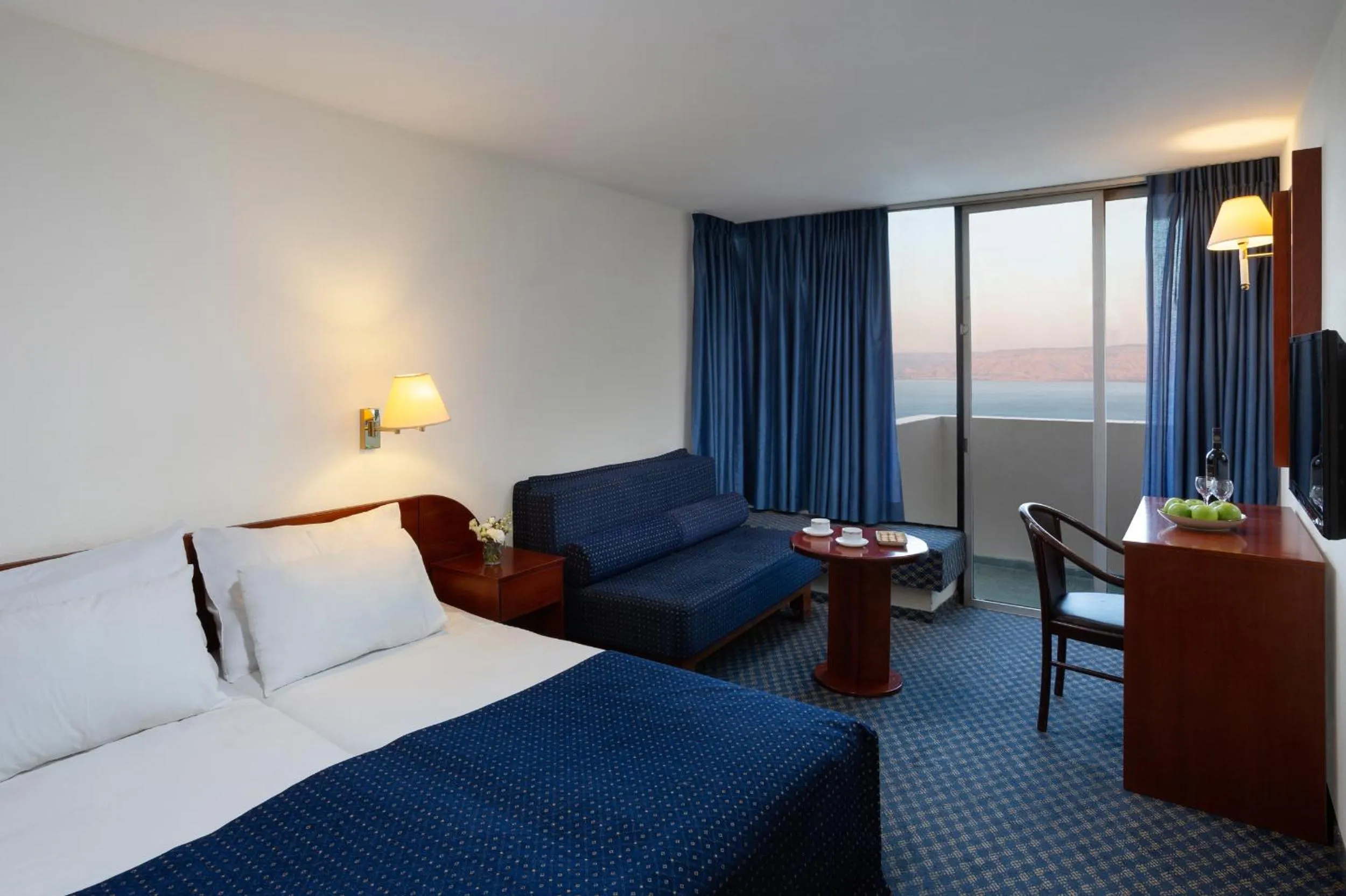 Living room, Bed in King Solomon Hotel Tiberias