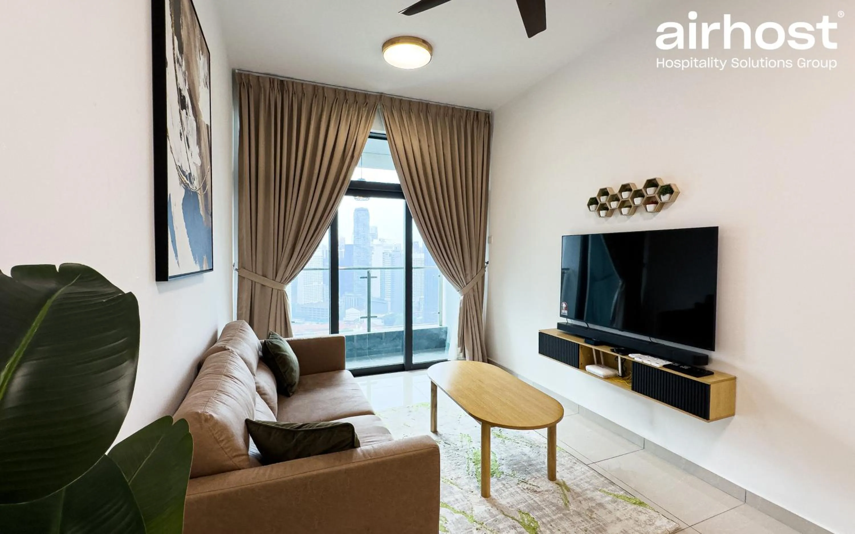 Communal lounge/ TV room in Legasi Kampung Baru by Airhost