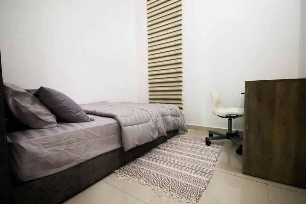 Bedroom in Legasi Kampung Baru by Airhost