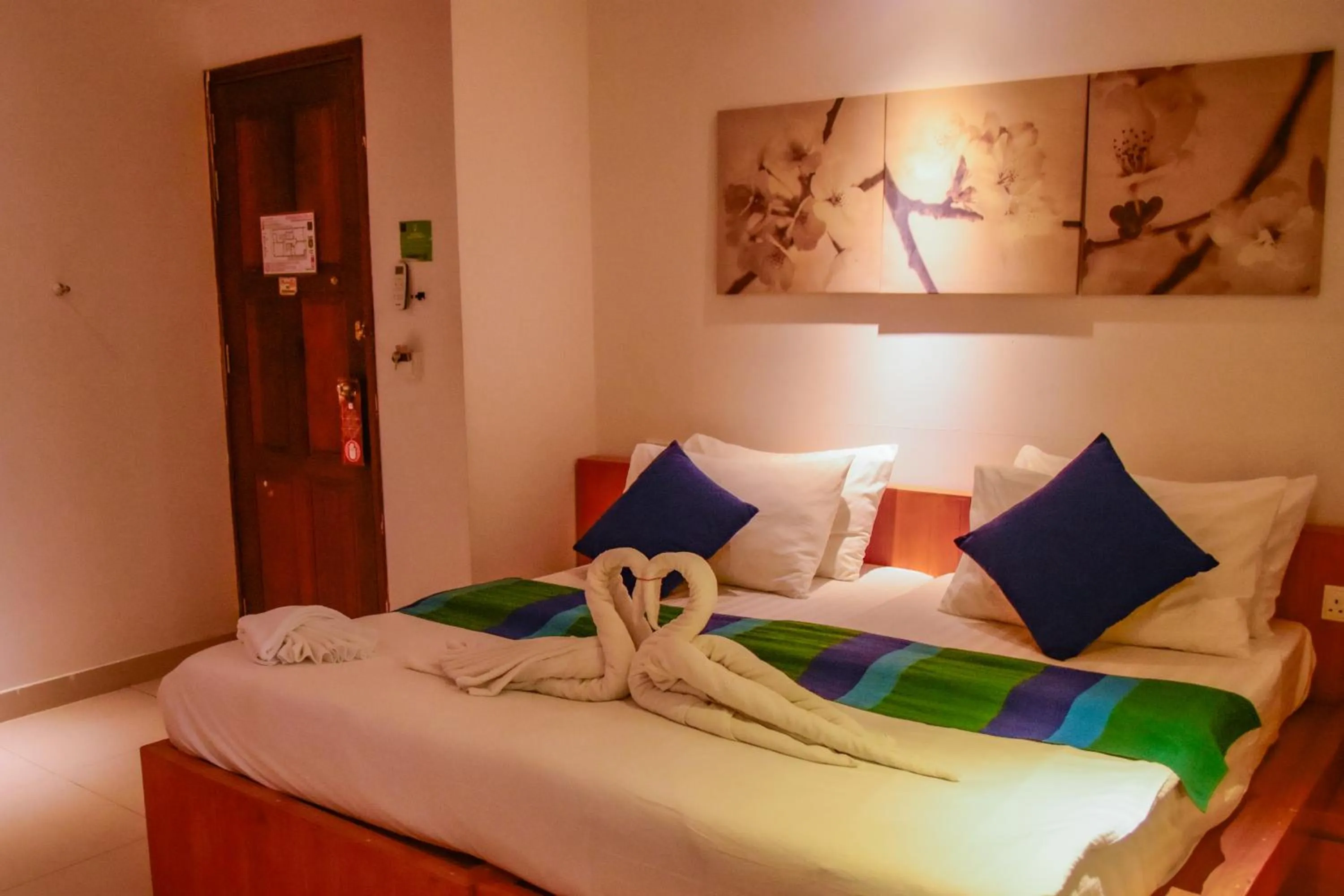 Bed in PINE LODGE MALDIVES