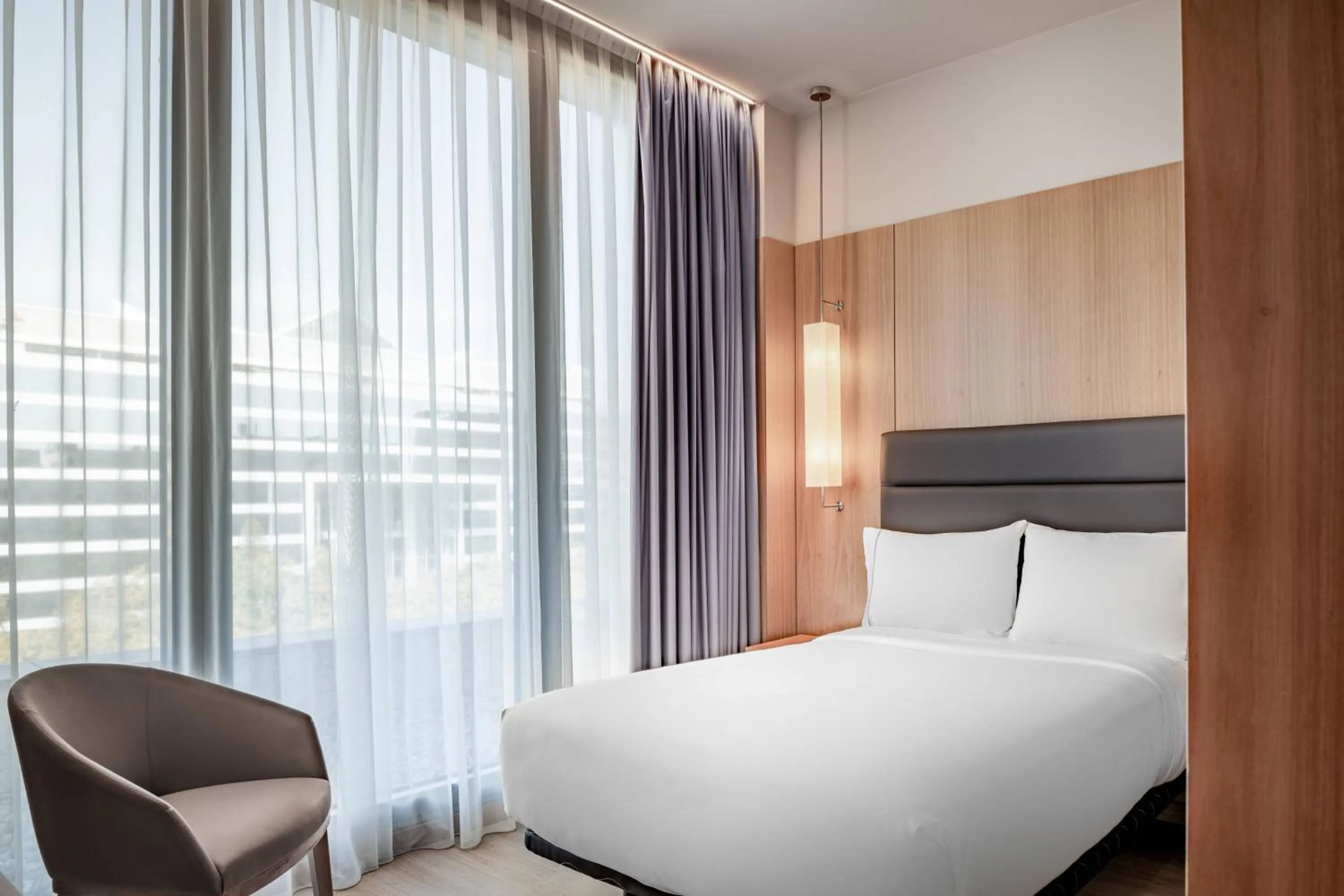 Photo of the whole room, Bed in AC Hotel Diagonal L'Illa by Marriott
