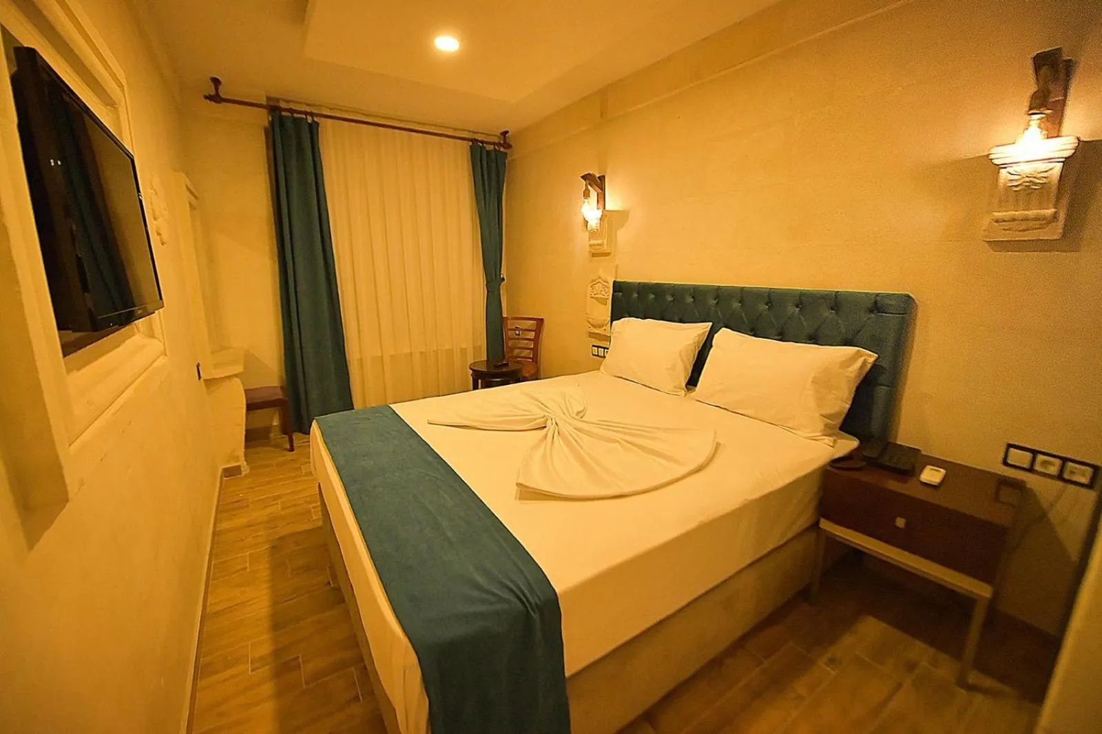 Bed in MİDYAT LADİNOS OTEL