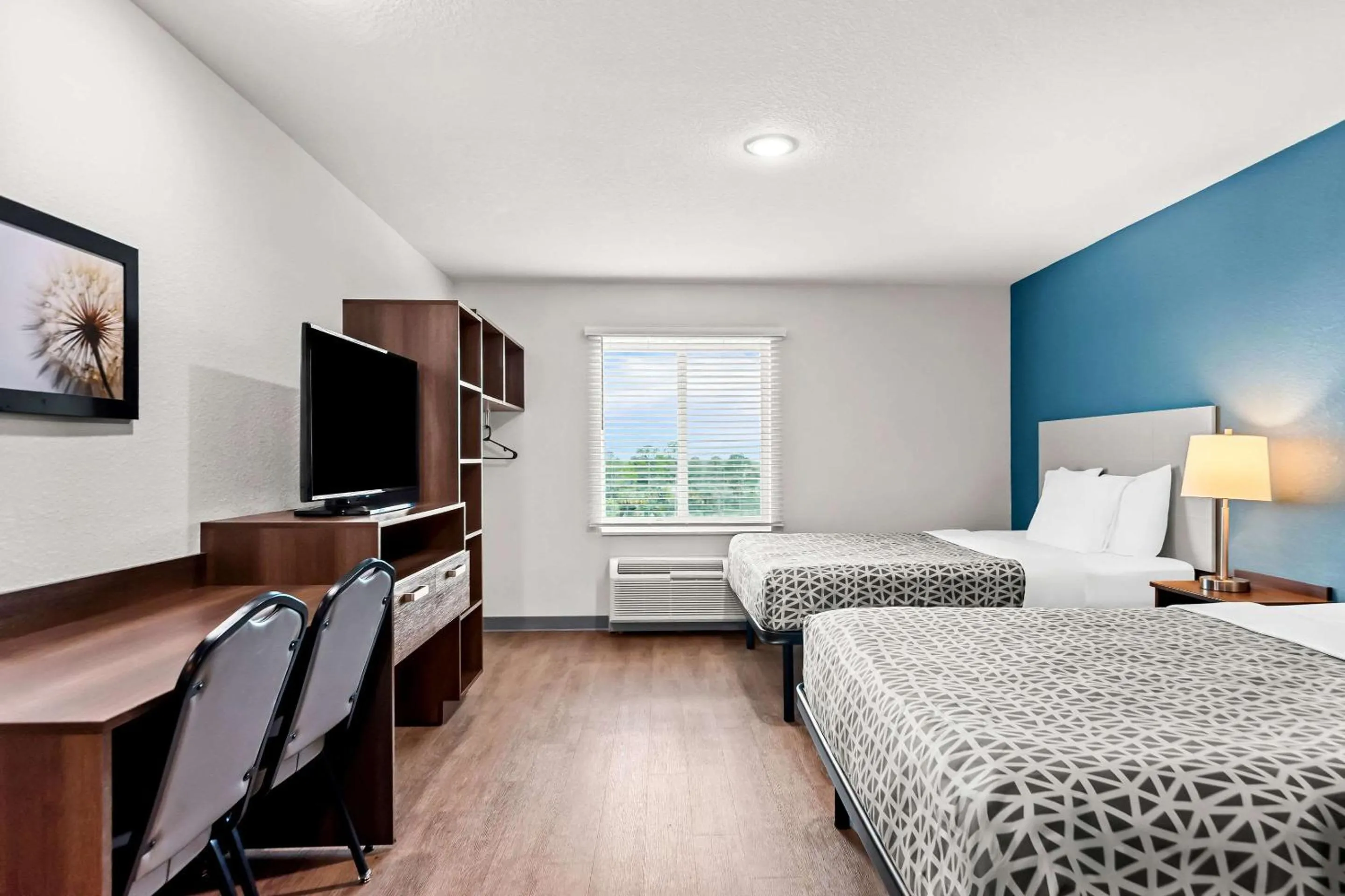 Bedroom, Bed in WoodSpring Suites Hudson Port Richey