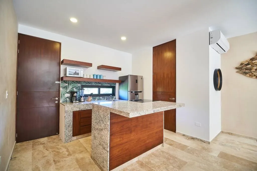 Kitchen or kitchenette in Amena Condo Tulum