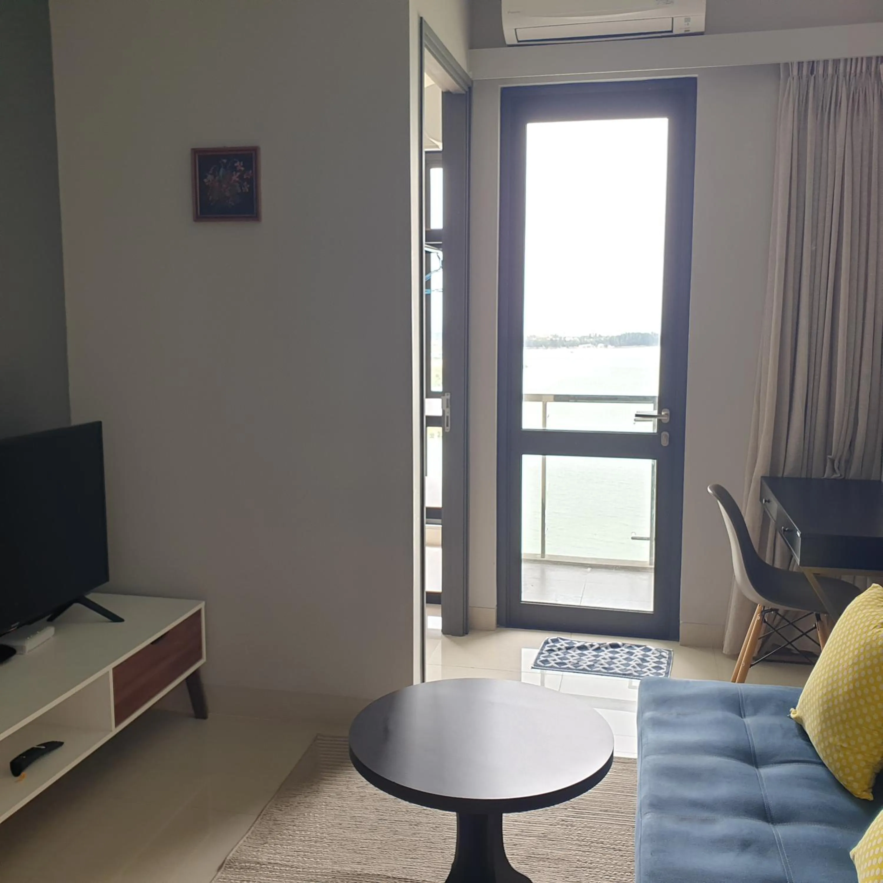 Living room in CozyHomes at One Residence Batam