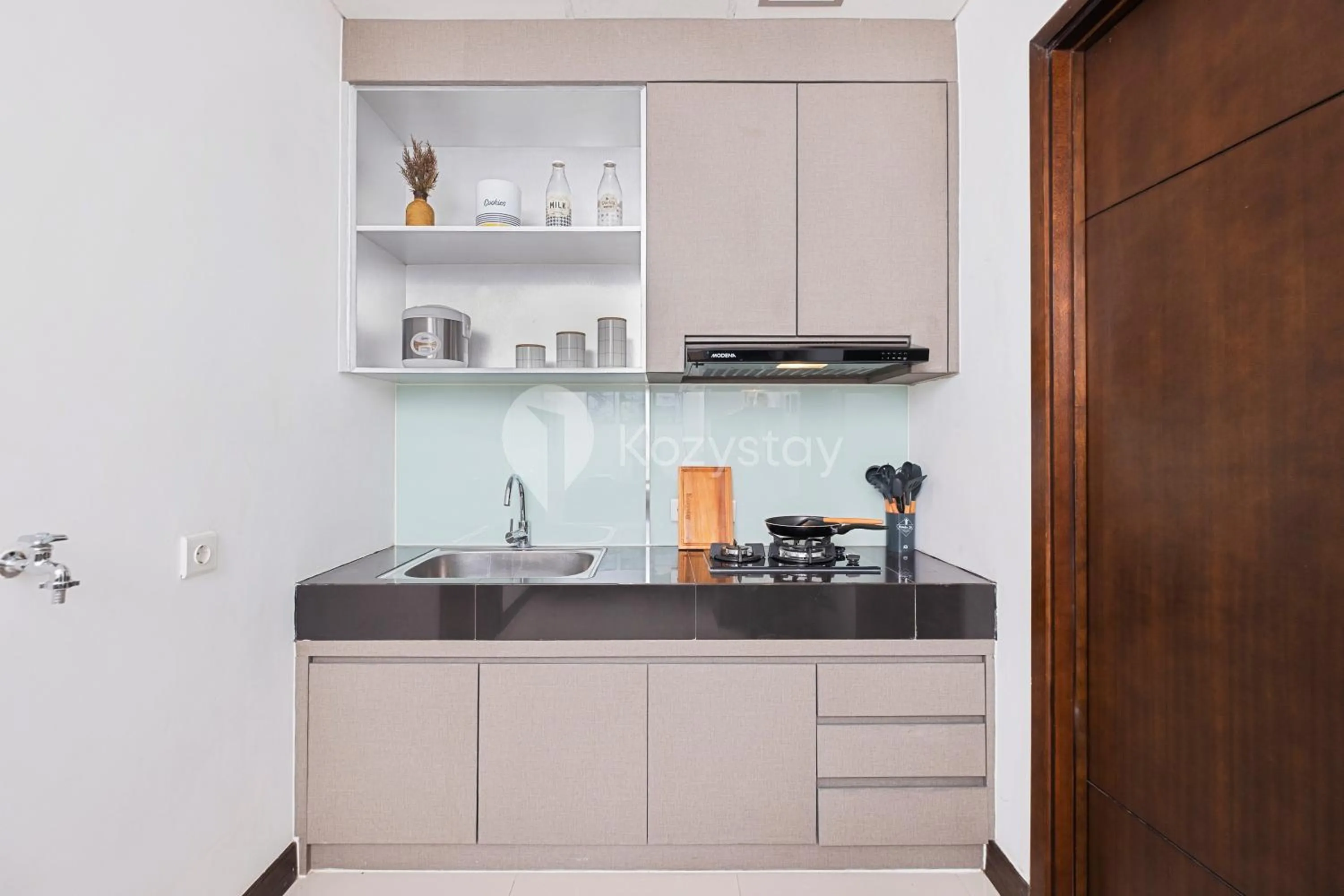 Kitchen or kitchenette in Orchid by Kozystay - Kebon Jeruk