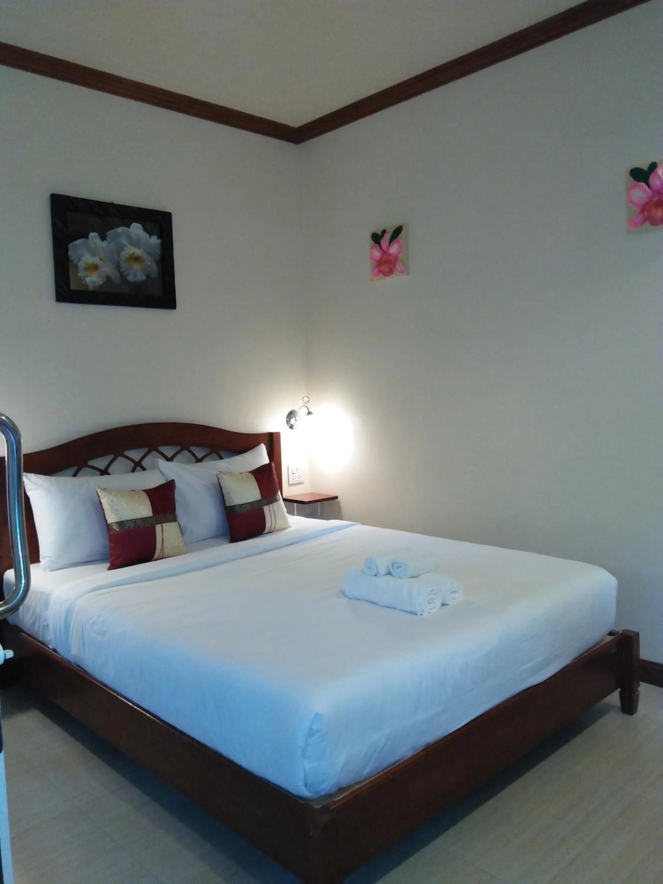 Bed in Khao Sok Palm Garden Resort