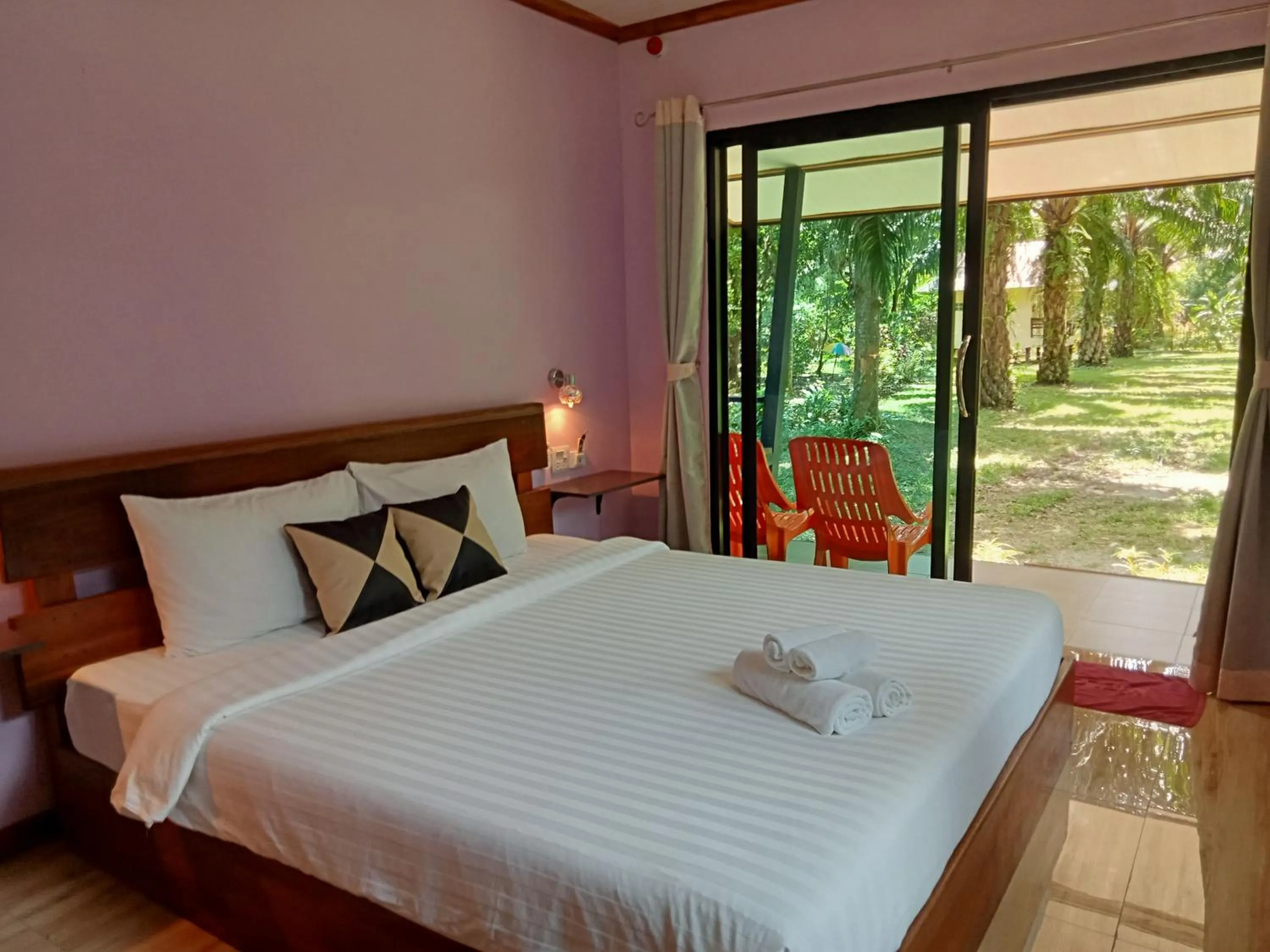 Bed in Khao Sok Palm Garden Resort