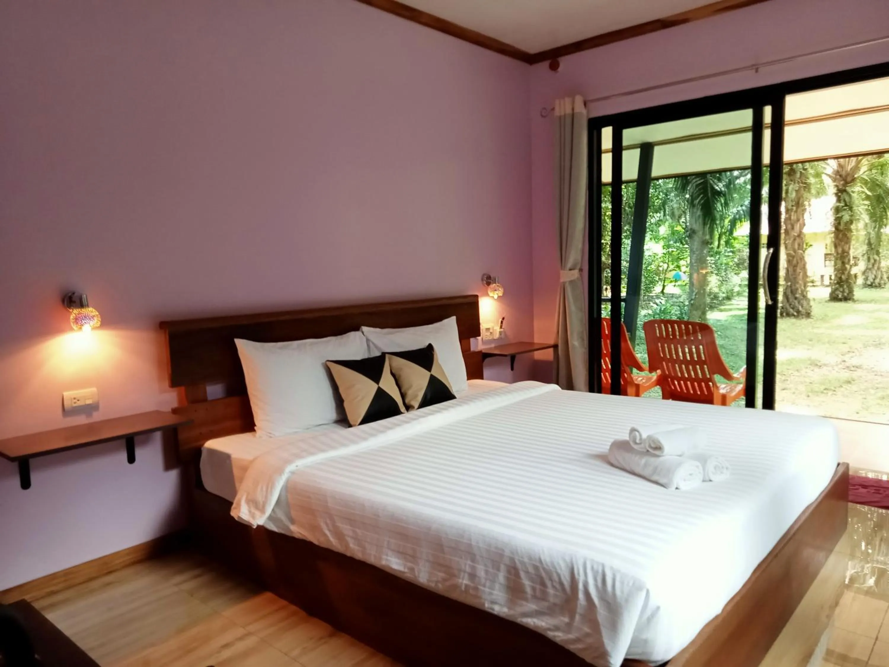 Bed in Khao Sok Palm Garden Resort