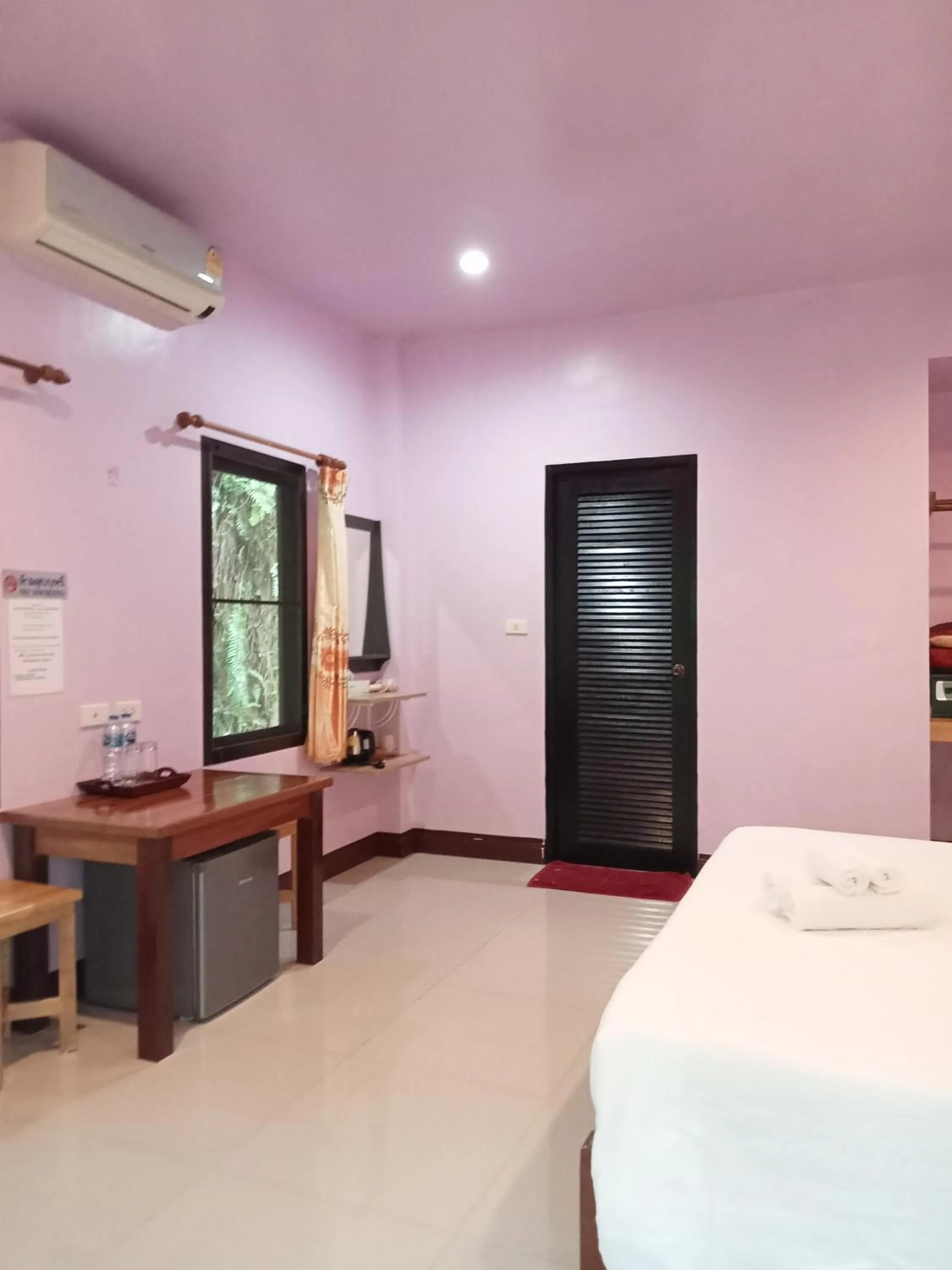 Bed in Khao Sok Palm Garden Resort