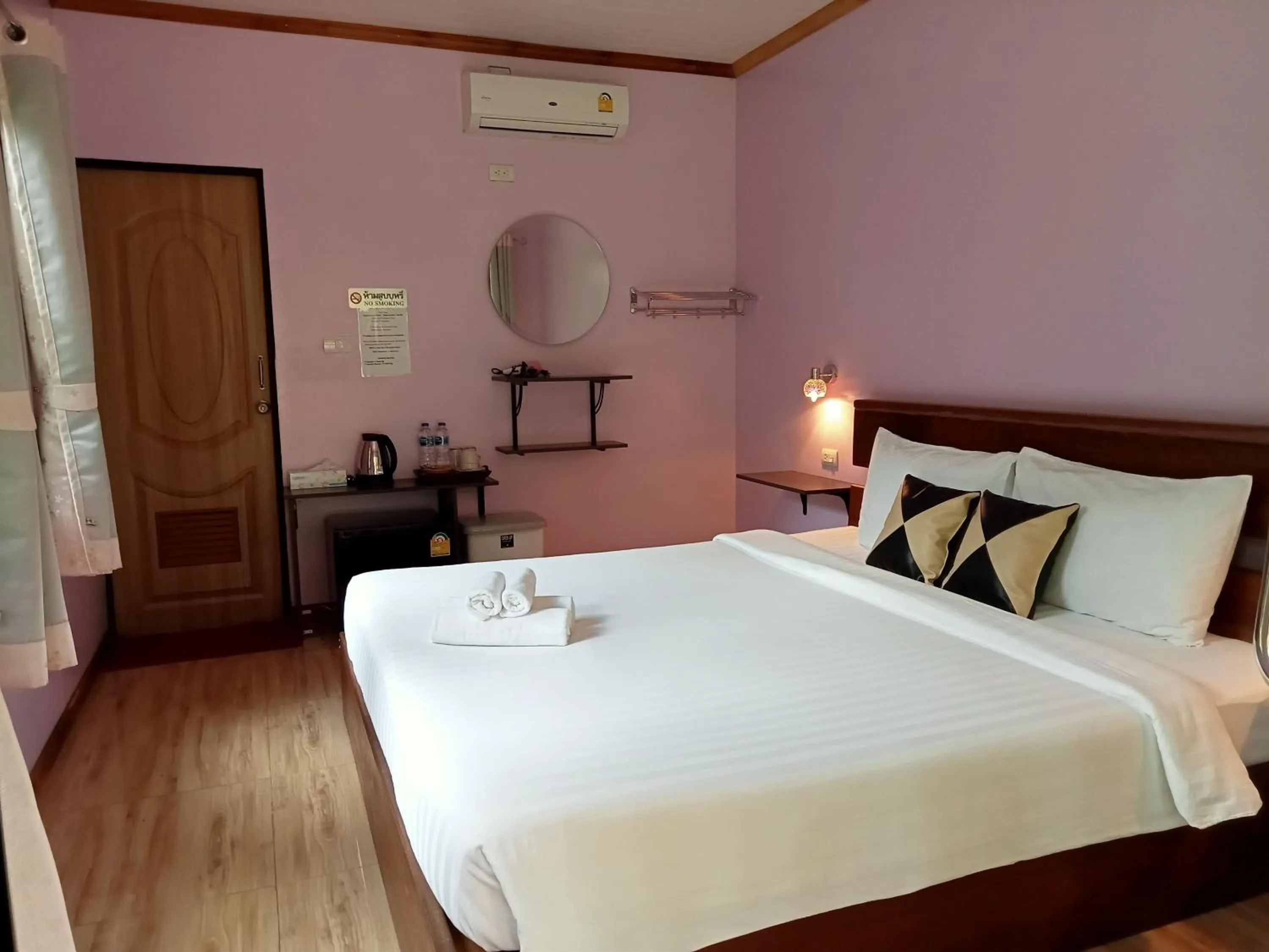 Bed in Khao Sok Palm Garden Resort