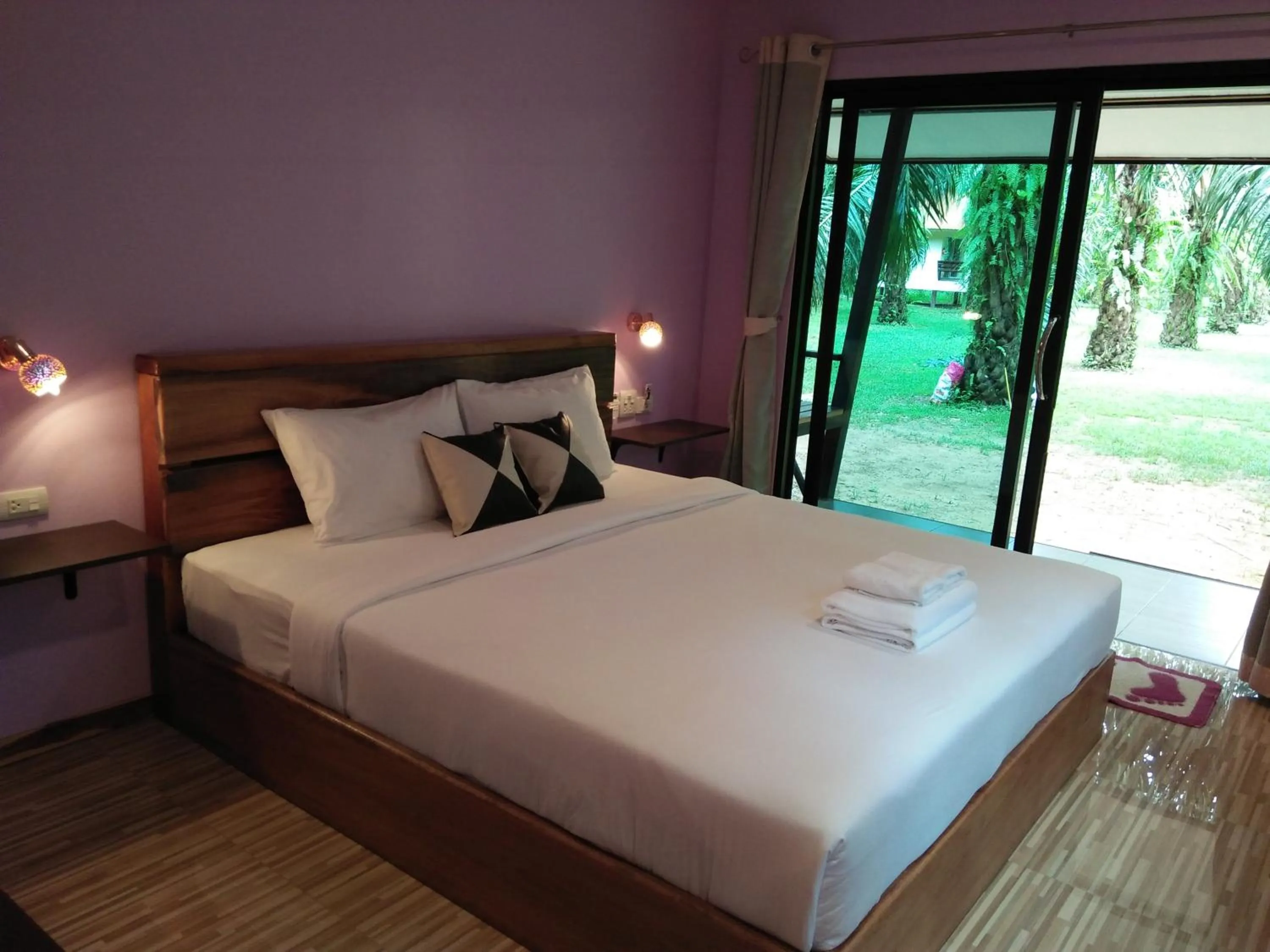 Bed in Khao Sok Palm Garden Resort